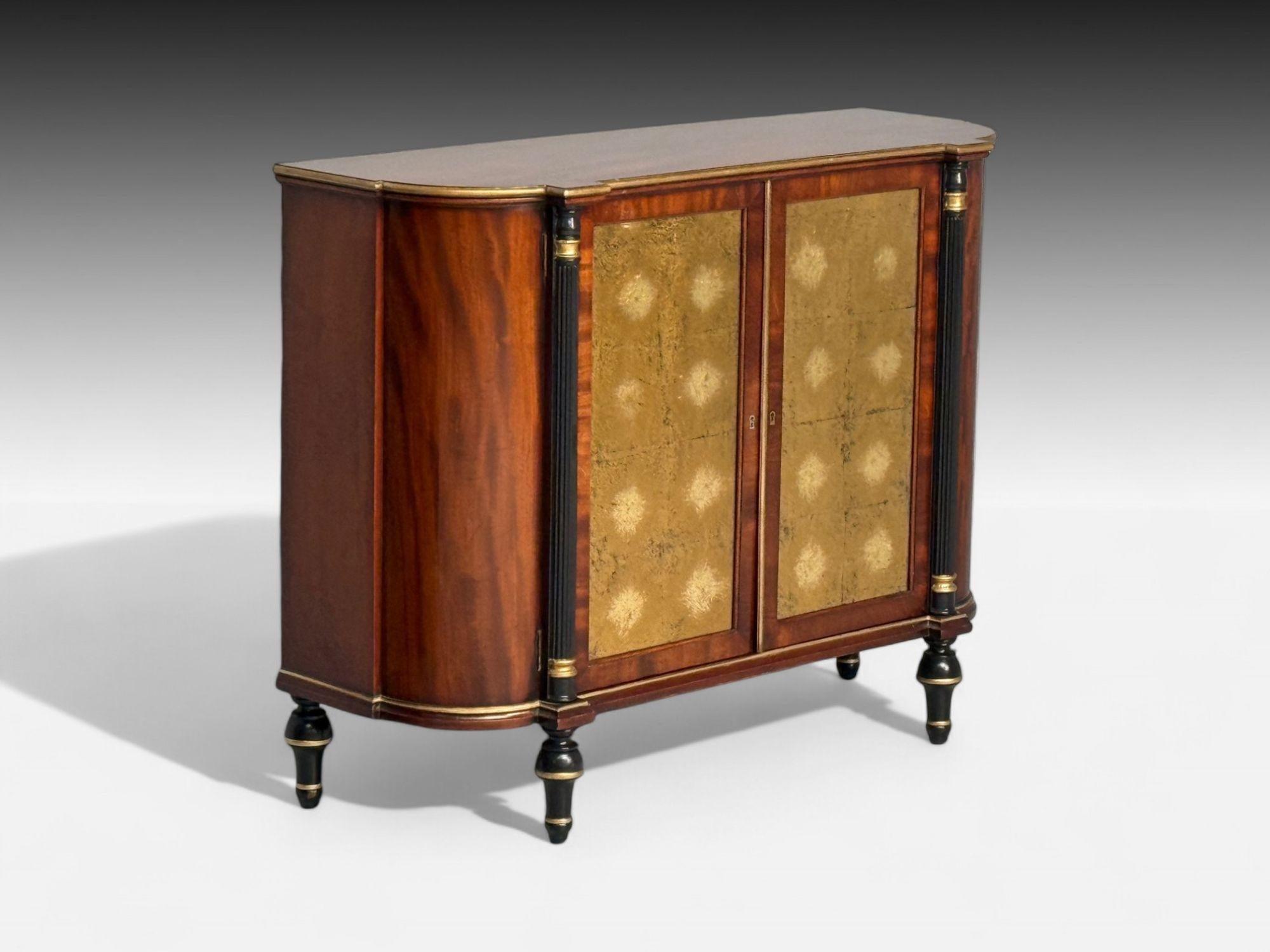 Maison Jansen Style, Hollywood Regency, Console Table Cabinets, Flame Mahogany, Eglomise Glass, USA, 1970s

A pair of custom-quality double-door cabinets or console tables, crafted from solid mahogany with ebony line inlays. Each features fitted