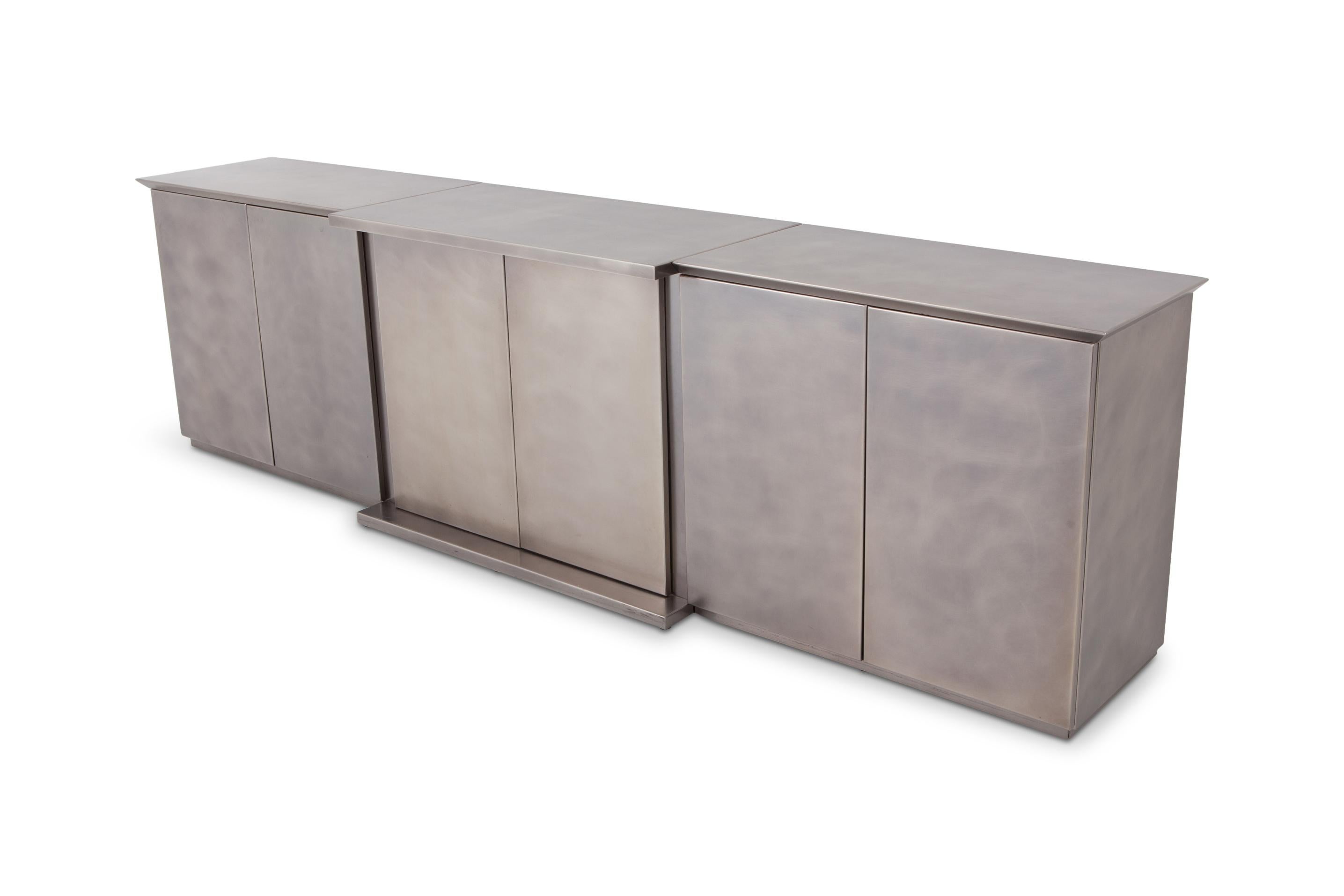 Postmodern metallic brushed stainless steel sideboard produced by Belgo Chrome, 1980s

The piece consists out of three elements with two large doors panels, creating loads of storage space.

Steel in mint condition.