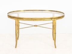 Table basse ovale en laiton imitation bambou, style Maison Jansen
