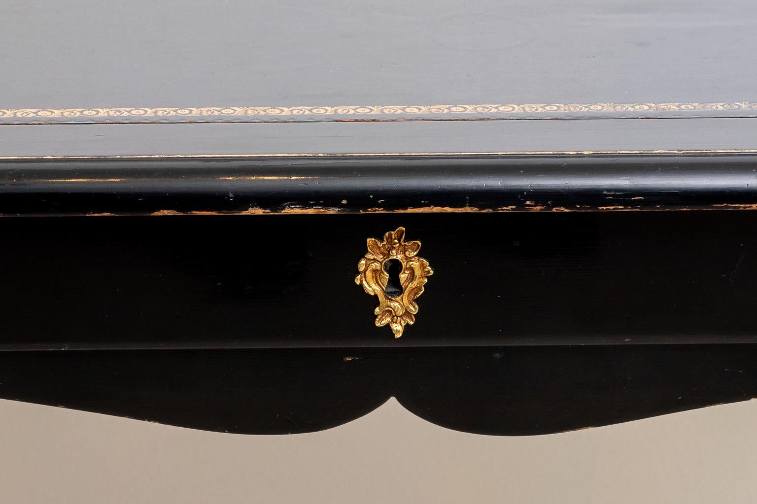 Circa 1920s Maison Jansen style French black lacquer desk with a leather embossed top. Please note of wear consistent with age.