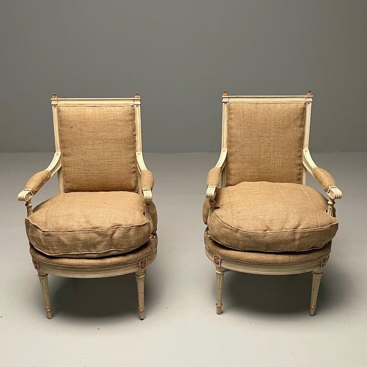 Maison Jansen Style, French Louis XVI, Arm Chairs, Giltwood, White Paint, Burlap

Pair of French Louis XVI style arm chairs newly re-upholstered in burlap fabric. This finely constructed pair of Maison Jansen inspired chairs are sleek and stylish in