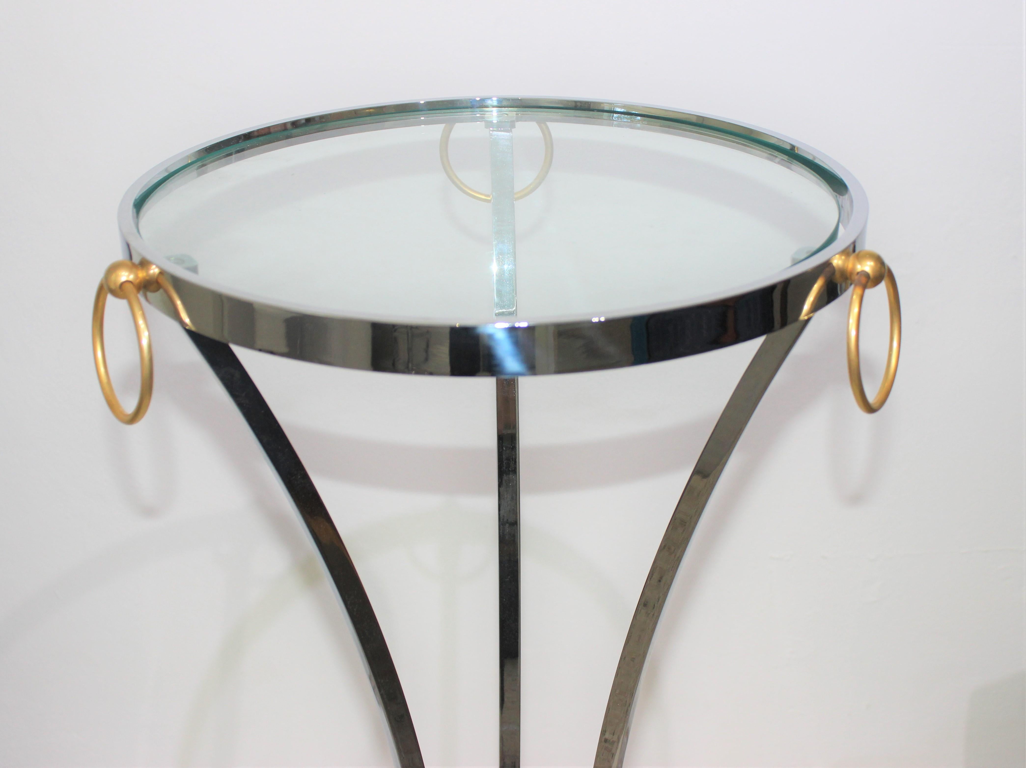 This stylish 1970s polished brass and chrome pedestal is very much in the style of pieces created by Maison Jansen.

Note: Diameter including the rings is approximately 17