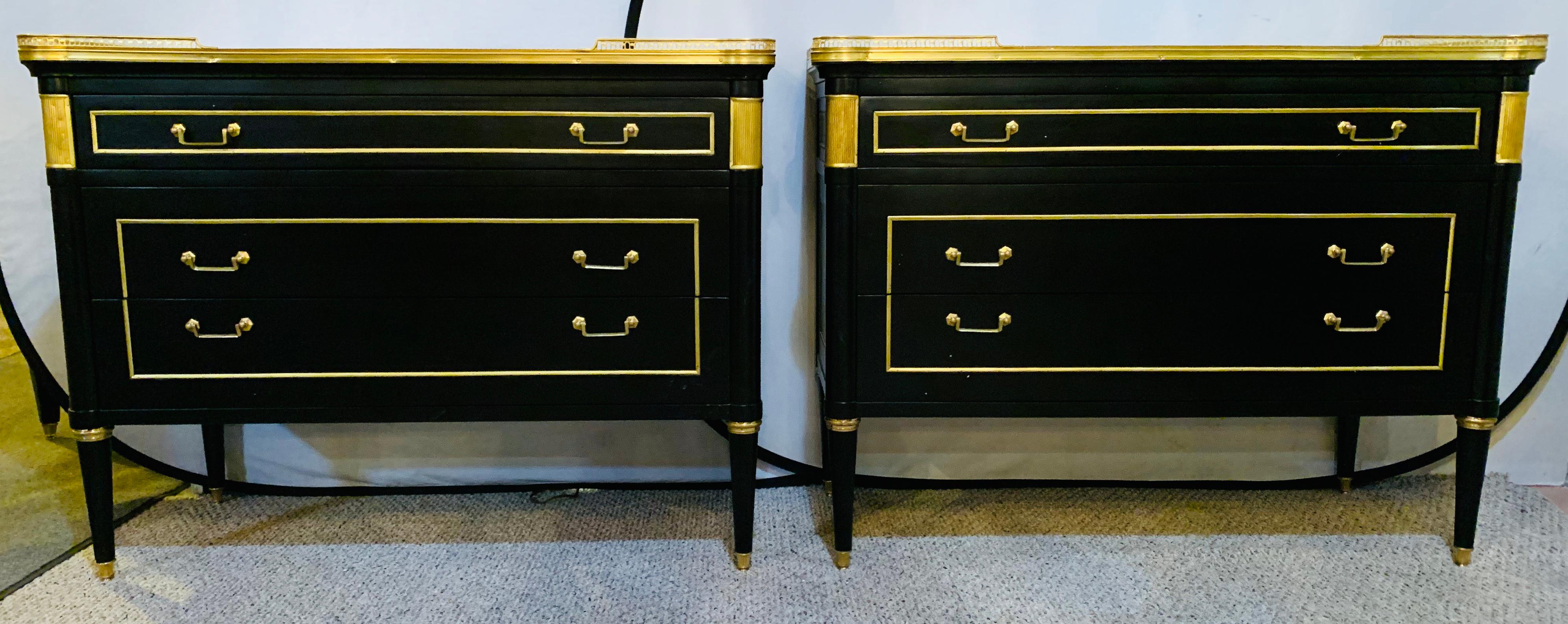 This is a stunning pair of large and impressive ebony bronze mounted commodes, nightstands or sideboards in the manner of Maison Jansen that have all the earmarks of the original item by this iconic designer. The case supporting a white and gray