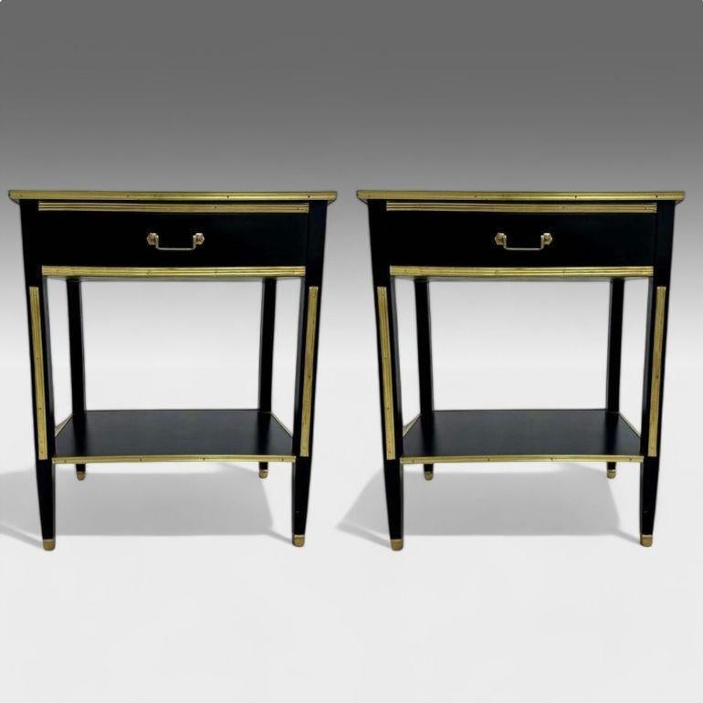 Maison Jansen Style, Hollywood Regency, Nightstands or End Tables, Black Painted Wood, Brass

A pair of Russian Neoclassical style bronze-mounted end tables, inspired by the late 1940s Maison Jansen aesthetic. Each table features tapering