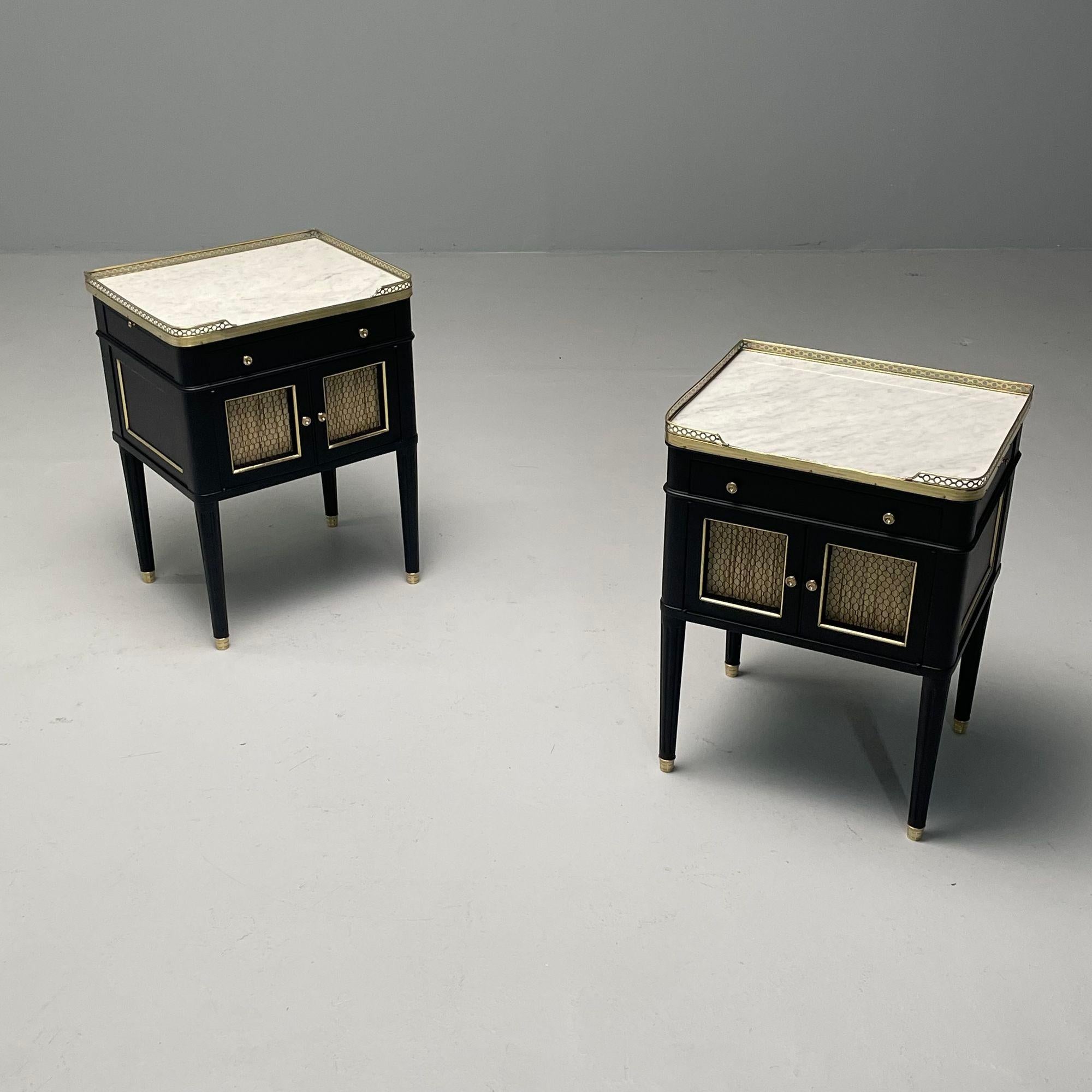 Maison Jansen Style, Hollywood Regency, Nightstands, Ebony, Oak, Marble, 1950s

Pair of fully restored nightstands, end or side tables, newly finished in a matte ebony. Each piece has a brass galleried white marble top above a single drawer and pull