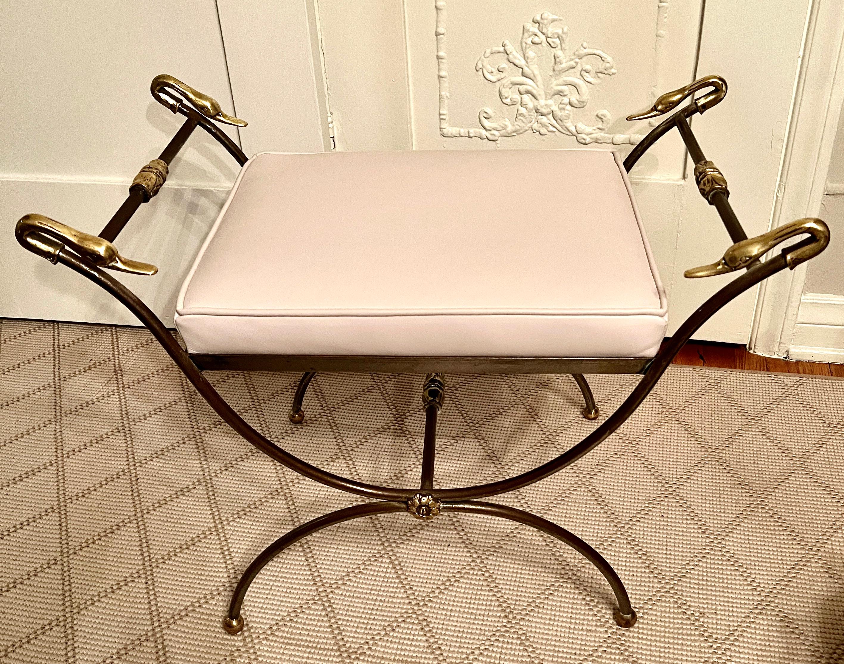 A classic Mid-Century Bench or Ottoman from the 1950'-1960's, or Hollywood Regency.   The inspiration is from bench that was very much in the French Empire Revival look with its Curule-form.  The leather is a caramel color, however we can fabricate