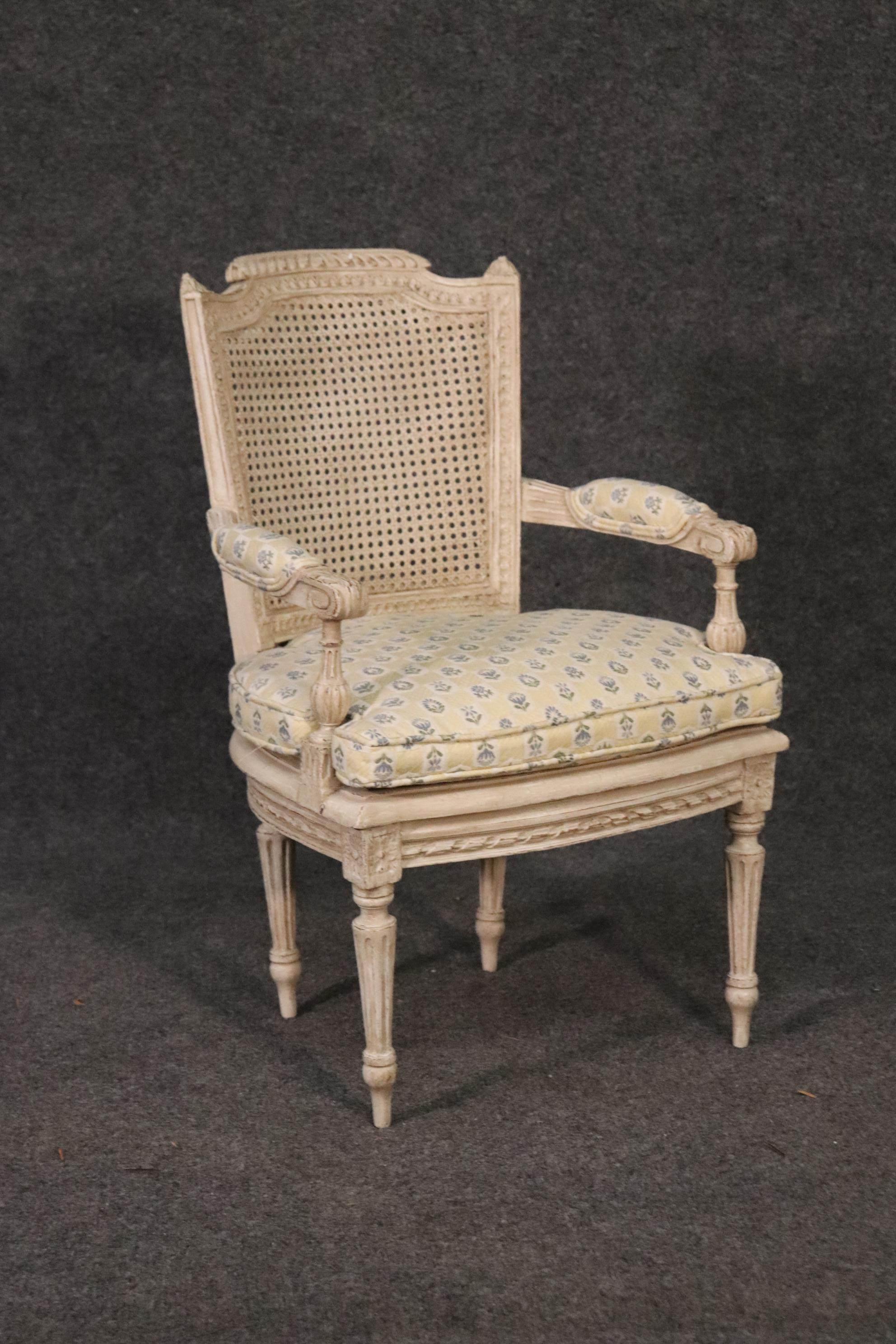 This is a salesman's sample or child's chair. The chair has a warped leg from age and is otherwise in good condition. The cane is not damaged. The paint is newer. The chairs measures 24.5 tall x 15 wide x 16.5 and a seat height of 13.