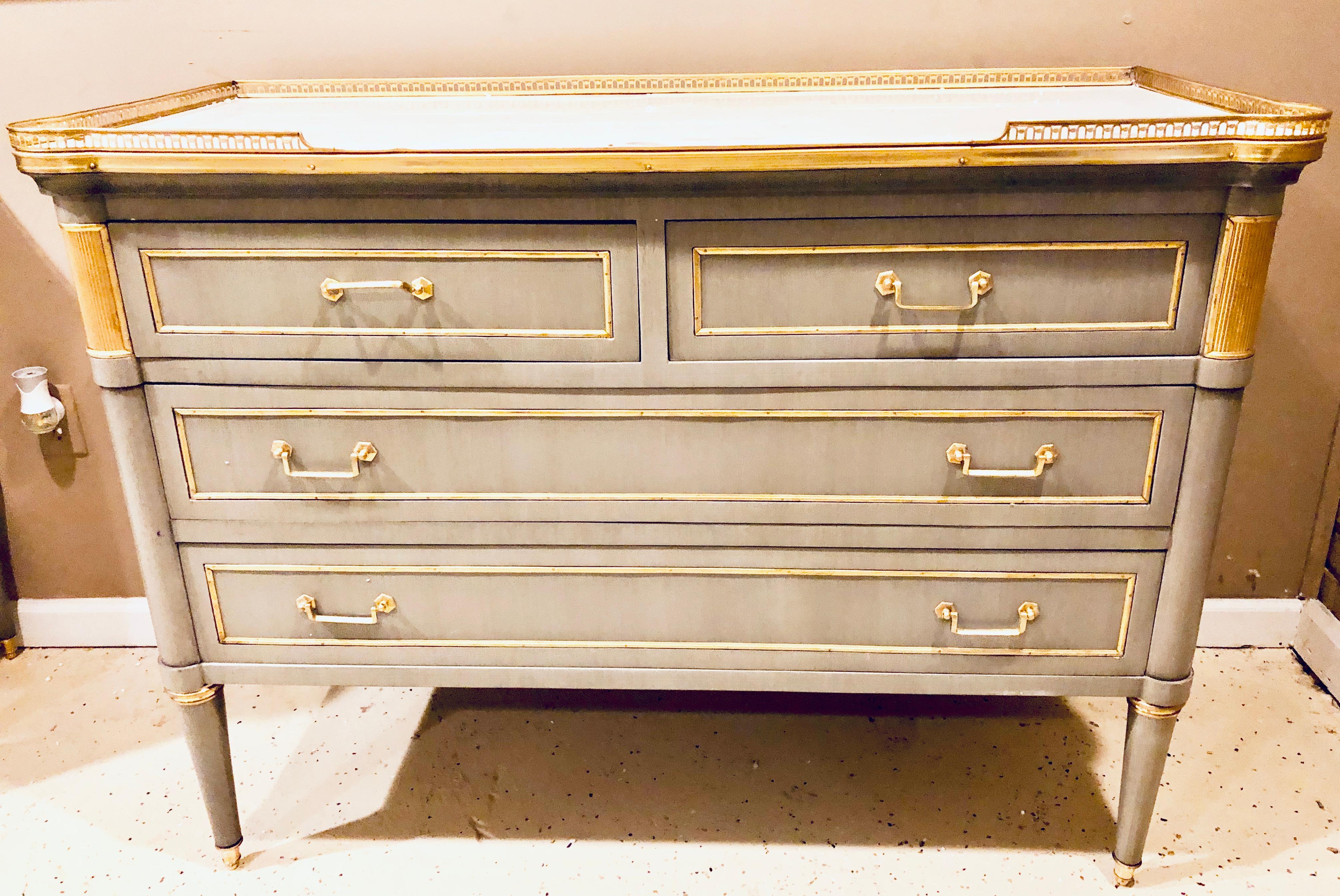 Maison Jansen style painted commodes, chests or nightstands a pair of stunning Louis XVI style fine bronze mounted chests each having a pierced bronze galleried marble top supported by two over two drawers all having a bronze frame and pulls. The