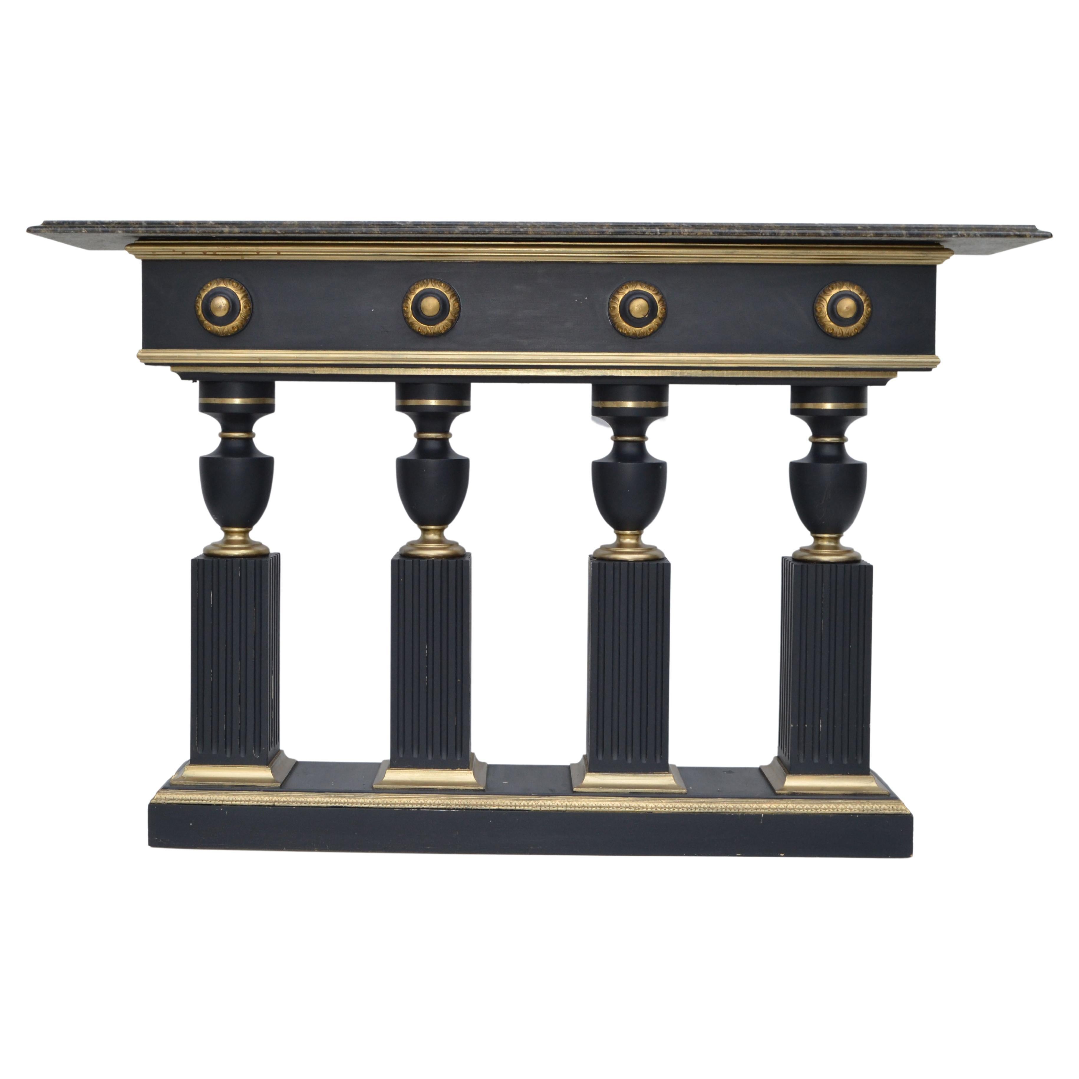 Superb black & gold console table in the style of Maison Jansen.
Features 4 ebonized turned wood pedestal base with gold gallerie decoration.
The beveled marble top in bronze, gold & white great for a pair of lamps or sculpture display. 
In