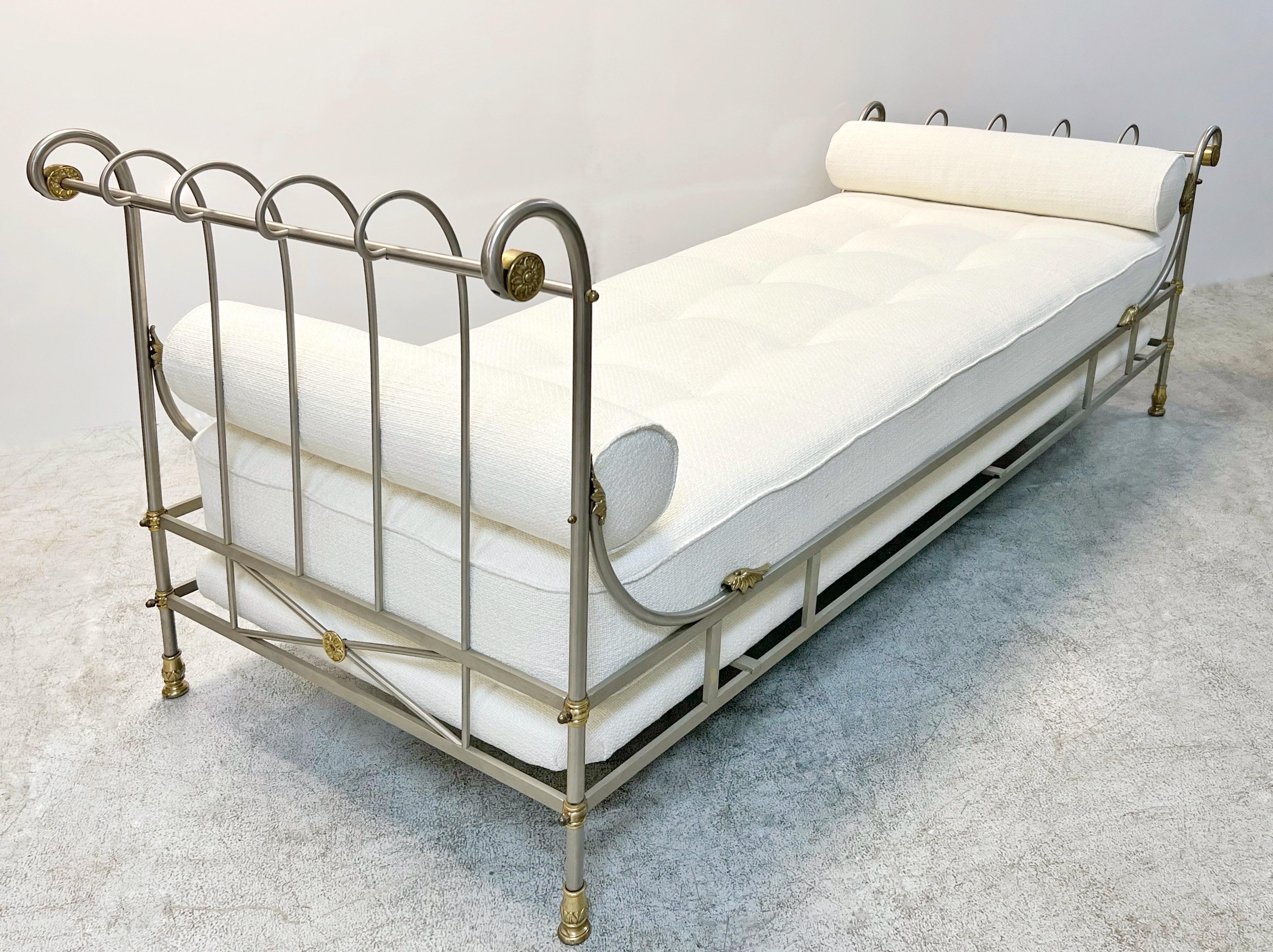 A brushed nickel and brass Directoire style daybed. 
Newly upholstered. The upholsterer pieces are removable and the frame disassemble.