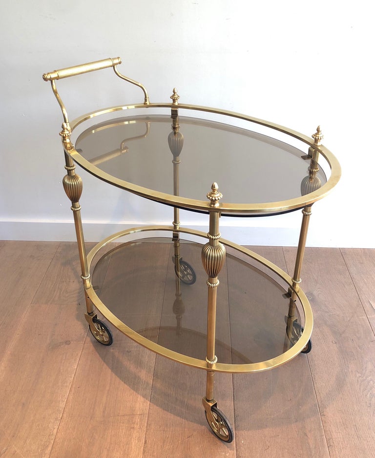 Maison Jansen Style Ovale Brass Bar Cart with Smoked Glass Shelves For Sale 4