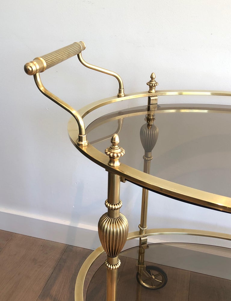 Neoclassical Maison Jansen Style Ovale Brass Bar Cart with Smoked Glass Shelves For Sale