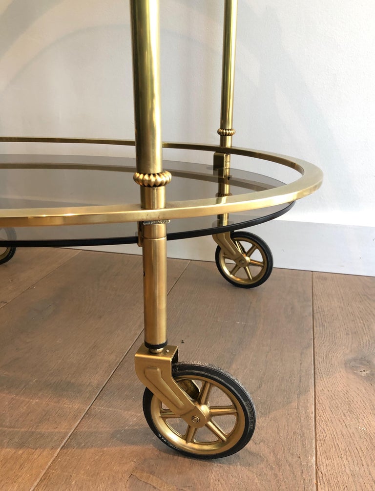 Mid-20th Century Maison Jansen Style Ovale Brass Bar Cart with Smoked Glass Shelves For Sale