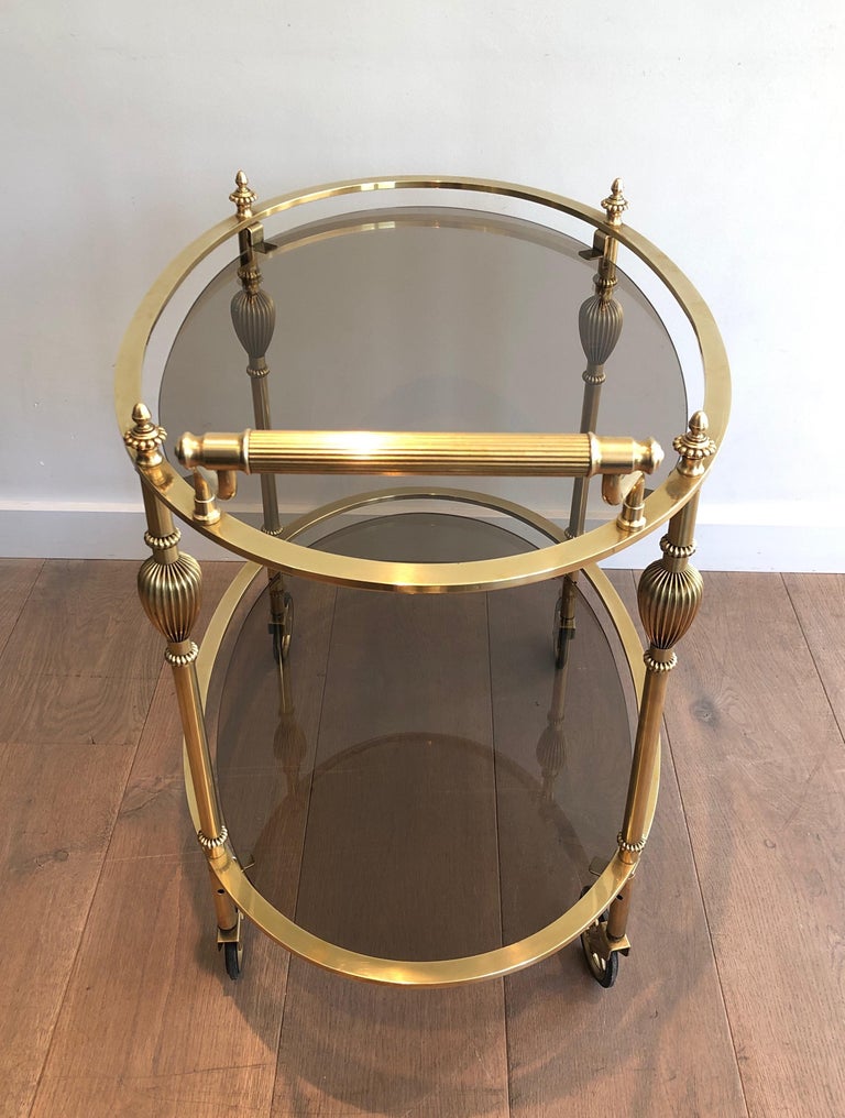 Maison Jansen Style Ovale Brass Bar Cart with Smoked Glass Shelves For Sale 2