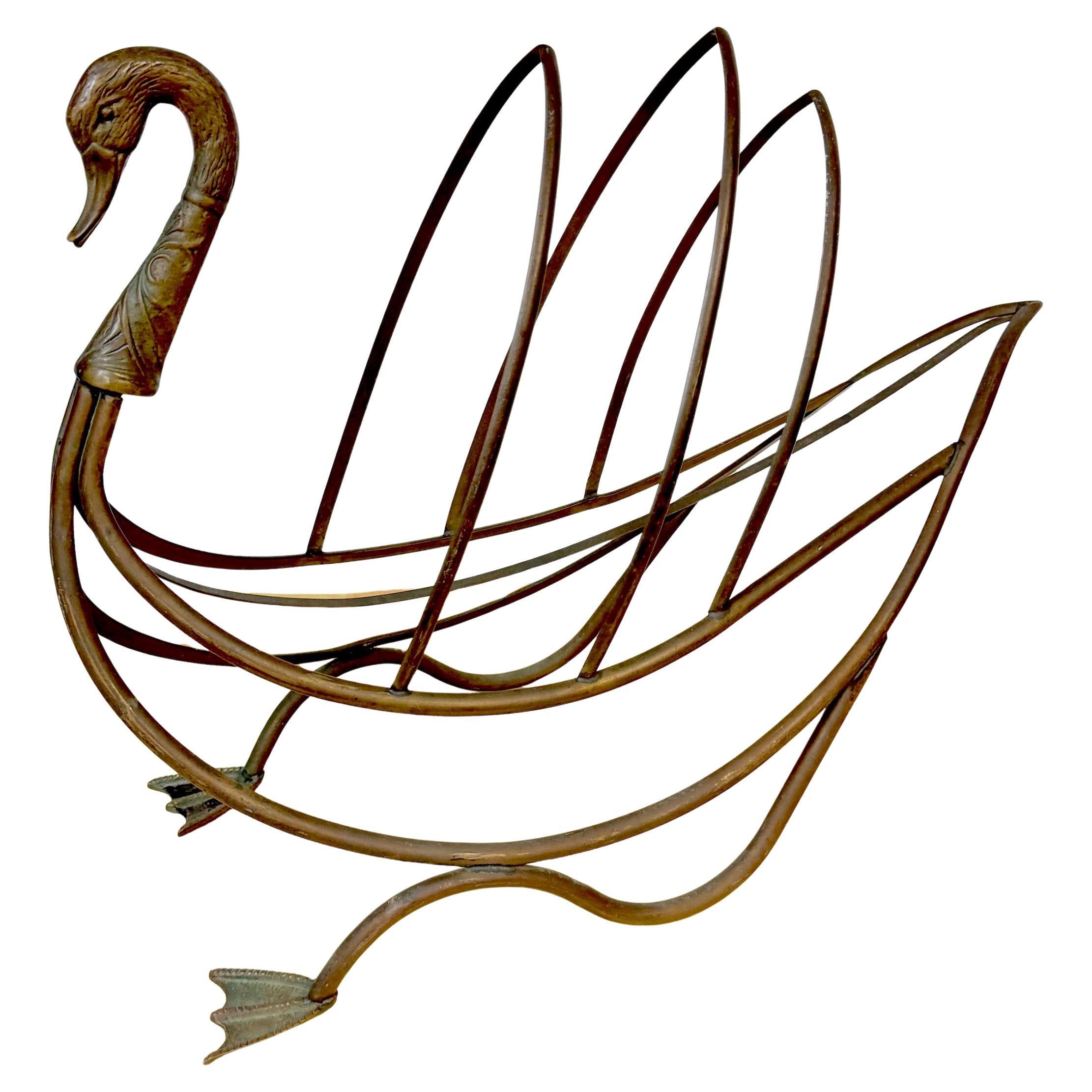 Maison Jansen Style Patinated Bronze Swan Magazine or Display Rack, Mid-20th Century

A sculptural and elegant patinated bronze rack in the form of a stylized swan, attributed to the Maison Jansen design aesthetic, France, mid-20th century. The
