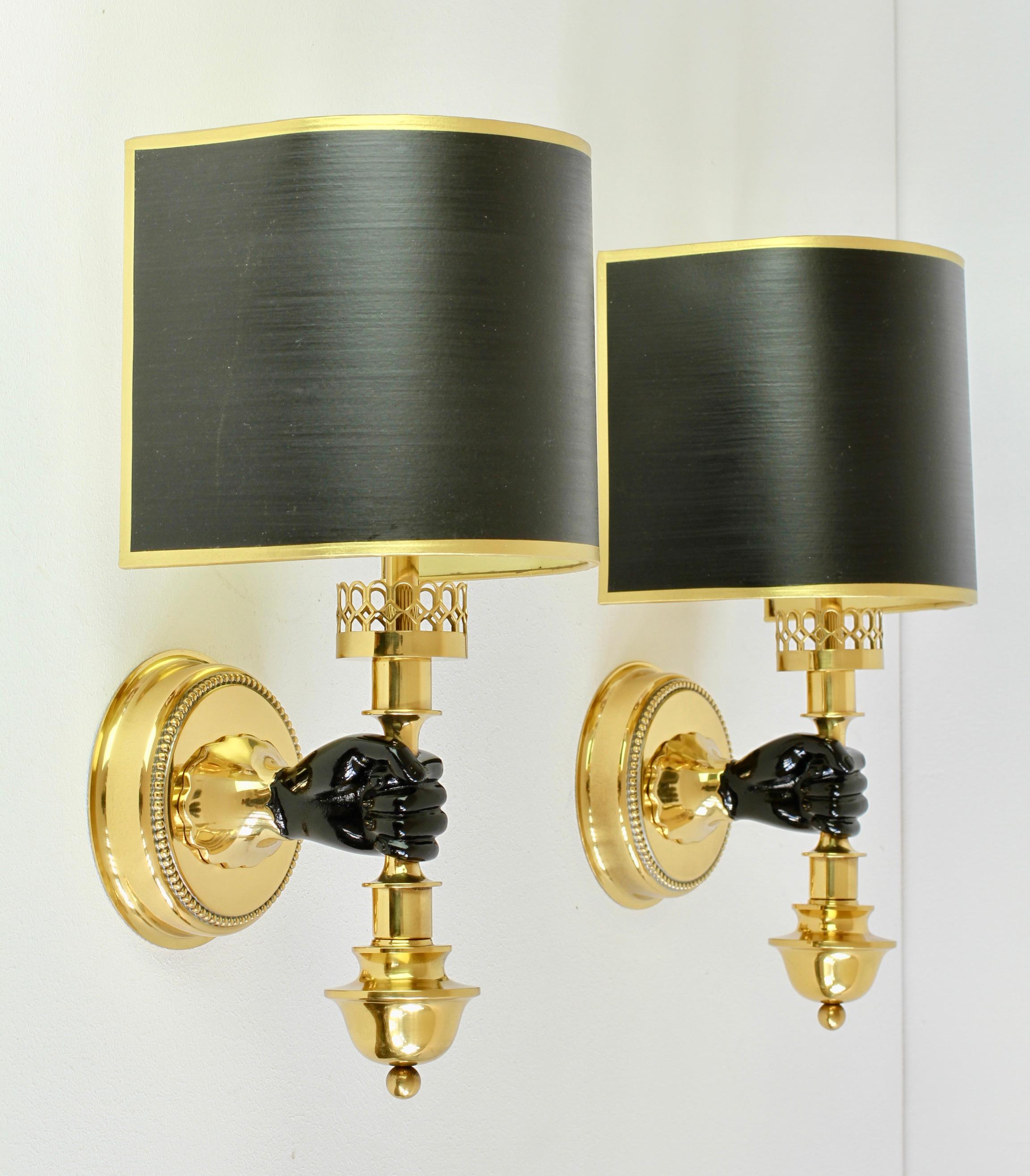 Stunning pair of vintage midcentury wall lights, lamps or sconces in solid cast brass with original black painted gold trim curved shades by the Vereinigten Werkstätten München (Munich) circa 1970s. Beautiful design and incredibly good craftsmanship