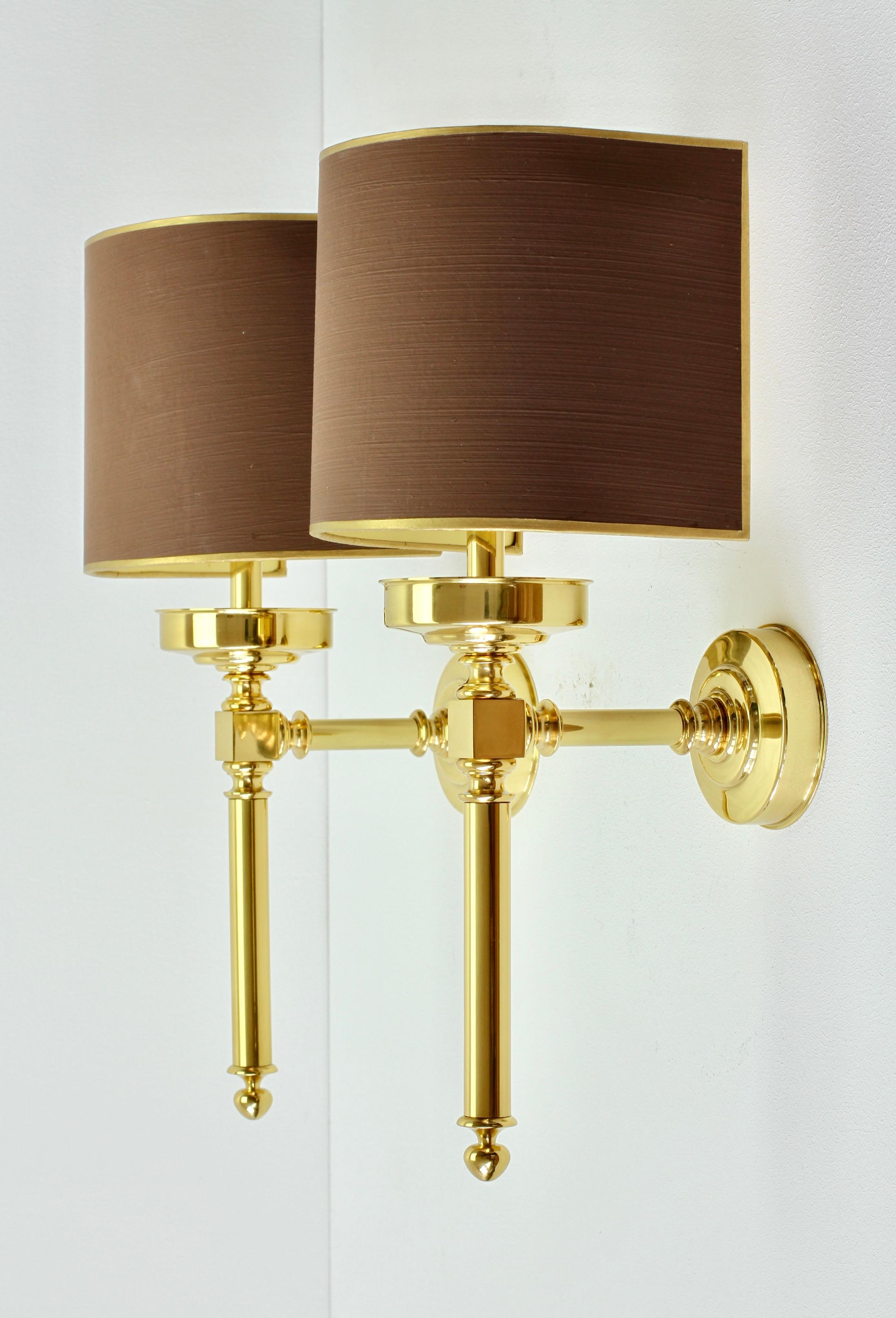 Stunning large pair of 'new old stock' vintage midcentury wall lights, lamps or sconces in polished brass with original maroon painted gold trim curved shades by the Vereinigten Werkstätten München (Munich), circa 1970s. Beautiful design and