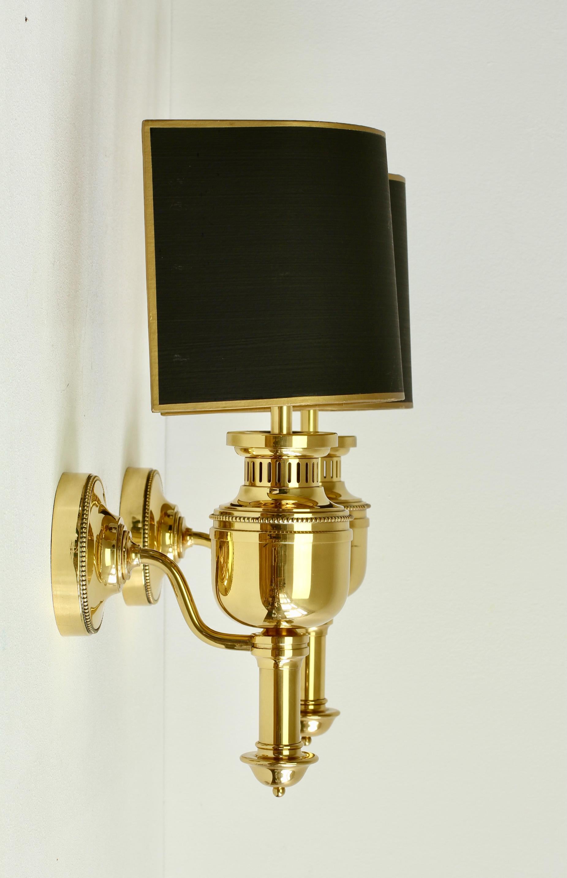 Stunning large pair of 'vintage midcentury wall lights, lamps or sconces in polished solid brass with original black hand-painted gold trim curved / half-round shades by the Vereinigten Werkstätten München (Munich), circa 1970s. Beautiful design and