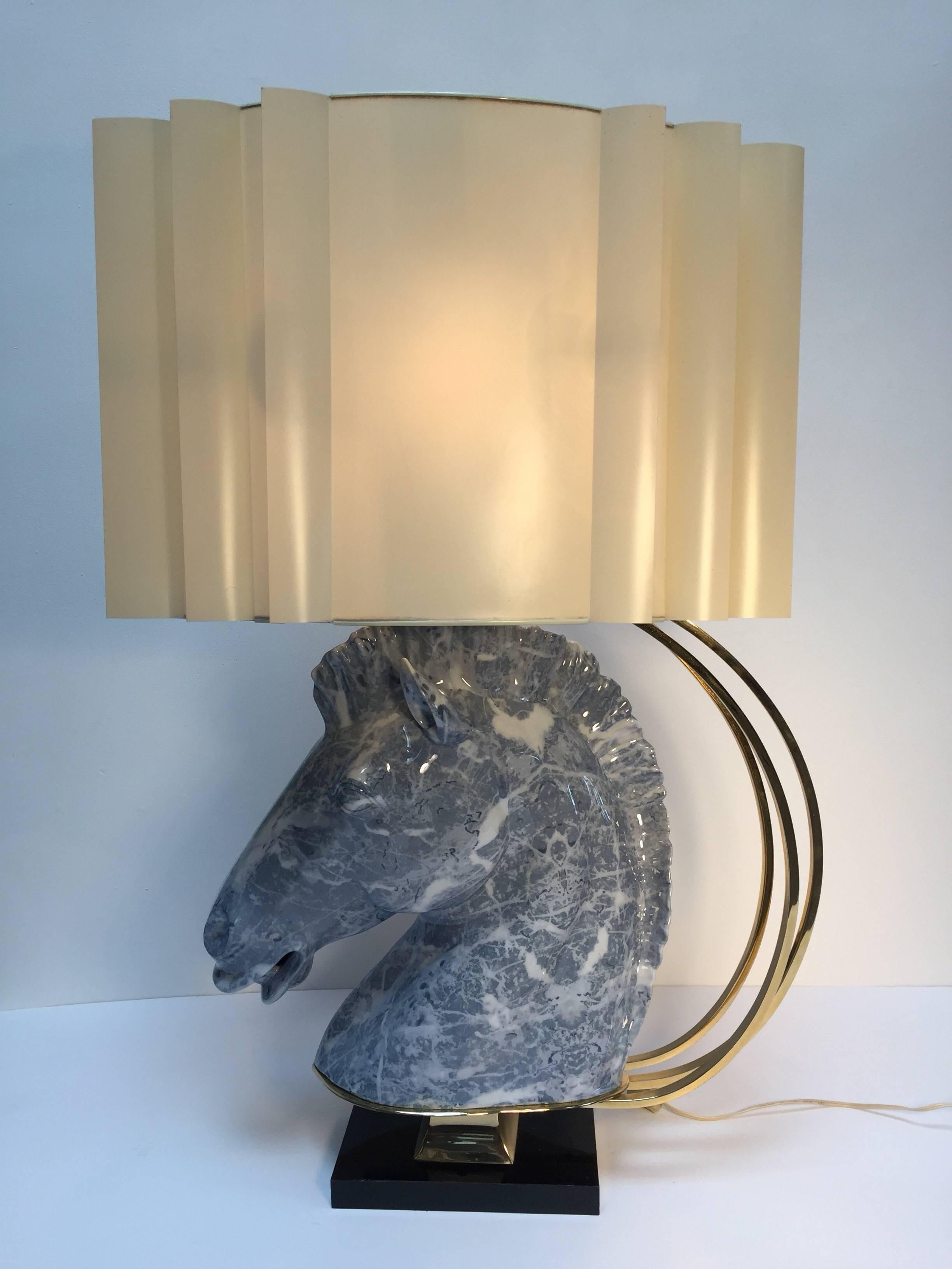 Ceramic sculptural Art Deco horse Bust, supported on brass stand on a black base, with brass double light fitting supporting an original custom shade.
A Maison Jansen style lamp ceramic horse head bust marbled in white and blue color.
Spectacular