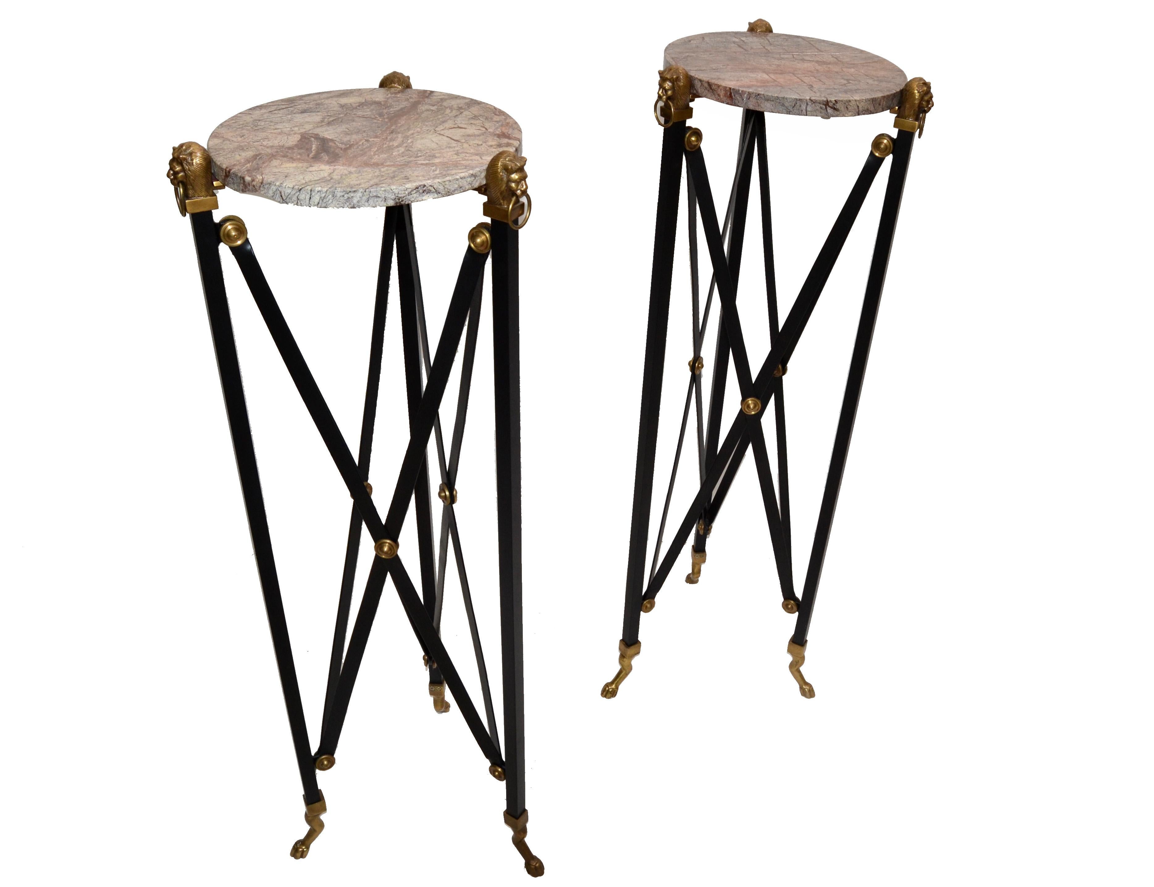 Pair of neoclassical Maison Jansen style sculpture stand / pedestal / side tables with a round stone top.
Beautifully crafted bronze lion head with detail brass ornaments and steel cross bars.
Cast bronze claw feet bases.
Round stone top