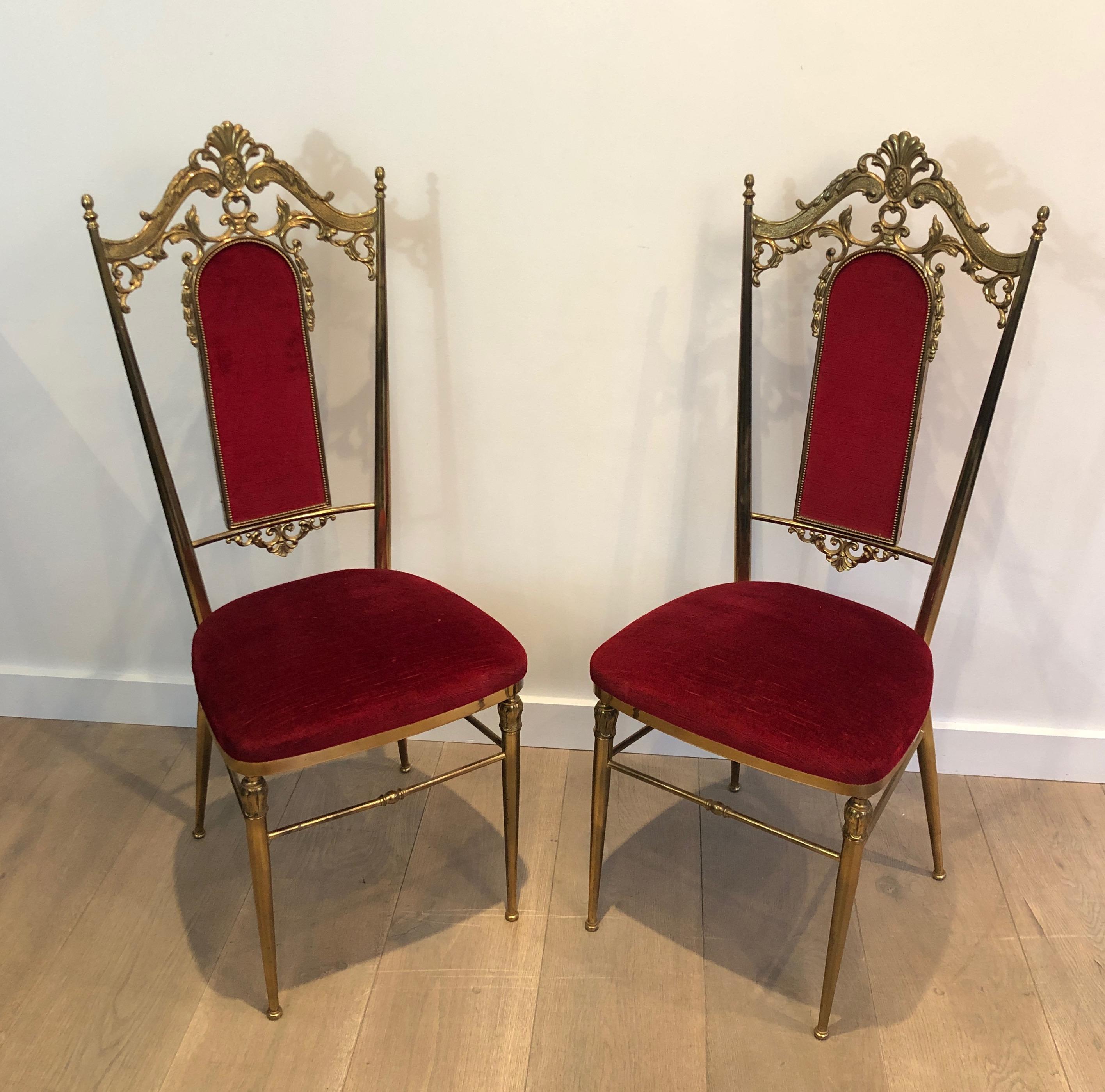 This nice and rare set of 4 neoclassical style chairs is made of brass and red velvet. This is a French work, in the style of famous designer Maison Jansen. Circa 1940.