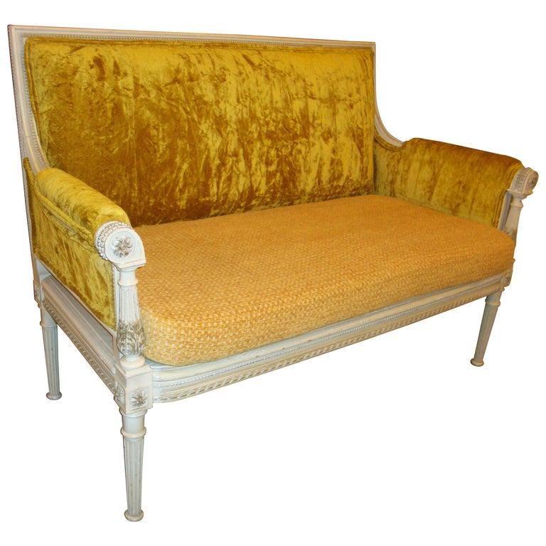 Vintage Maison Jansen style settee with white painted finish and yellow velvet upholstery.