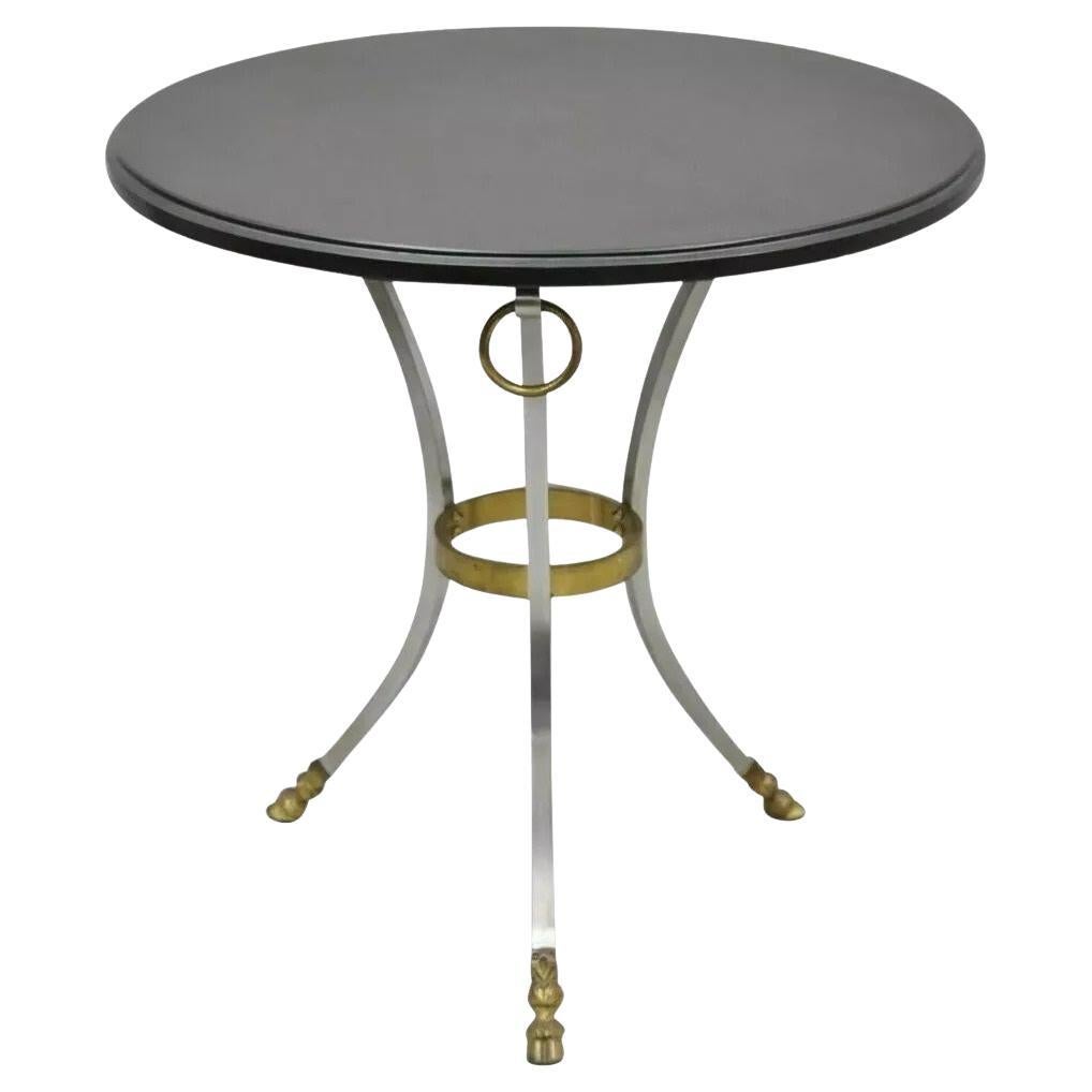Tavolino Regency in stile Maison Jansen con zoccolo rotondo in acciaio e bronzo e piano in ardesia