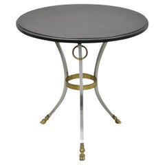 Tavolino Regency in stile Maison Jansen con zoccolo rotondo in acciaio e bronzo e piano in ardesia