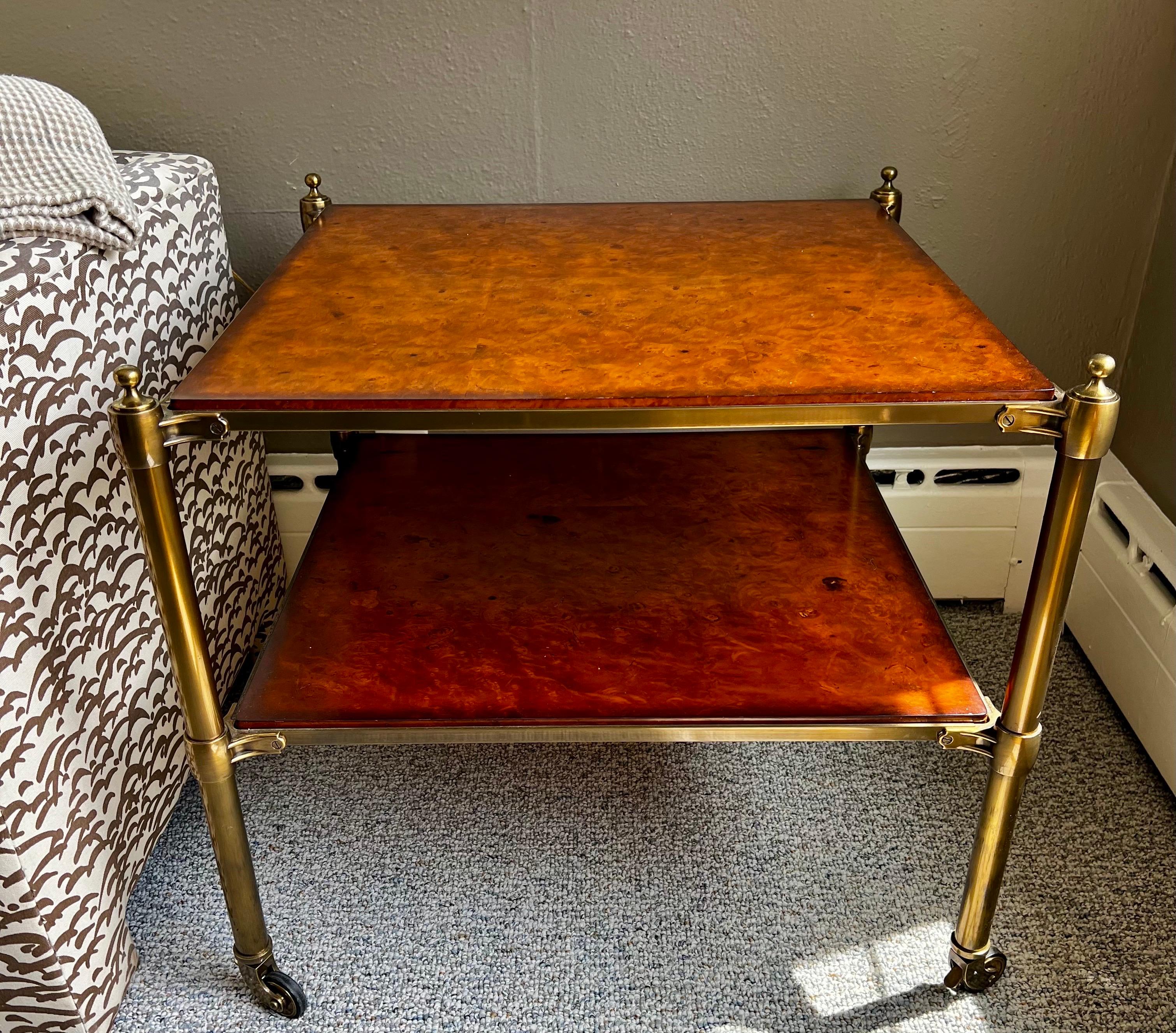 Tiger maple two tiered side table with brass supports and castor wheels by Barclay Butera - an ode to Maison Jansen. Gorgeous lines and better scale. Why not own the best?