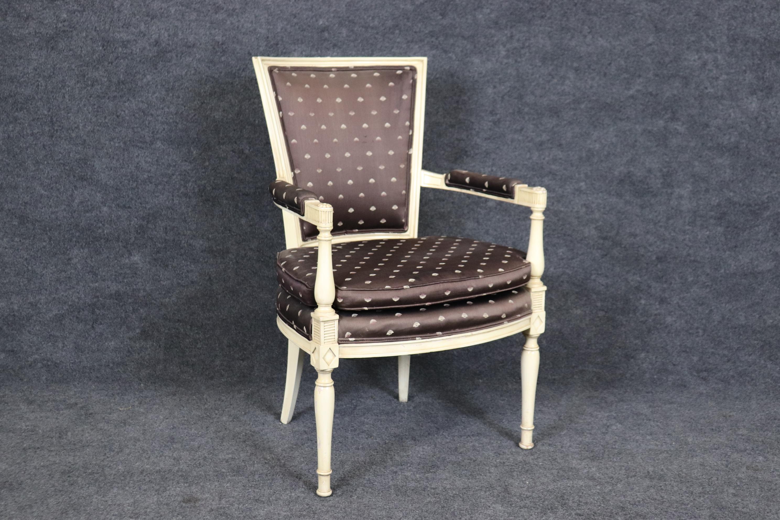 This is a gorgeous Directoire French-made Maison Jansen style armchair. The chair looks like Jansen and may very well be but isn't marked. The chair is in good condition with normal age-related wear to frame, finish and minor wear to upholstery.
