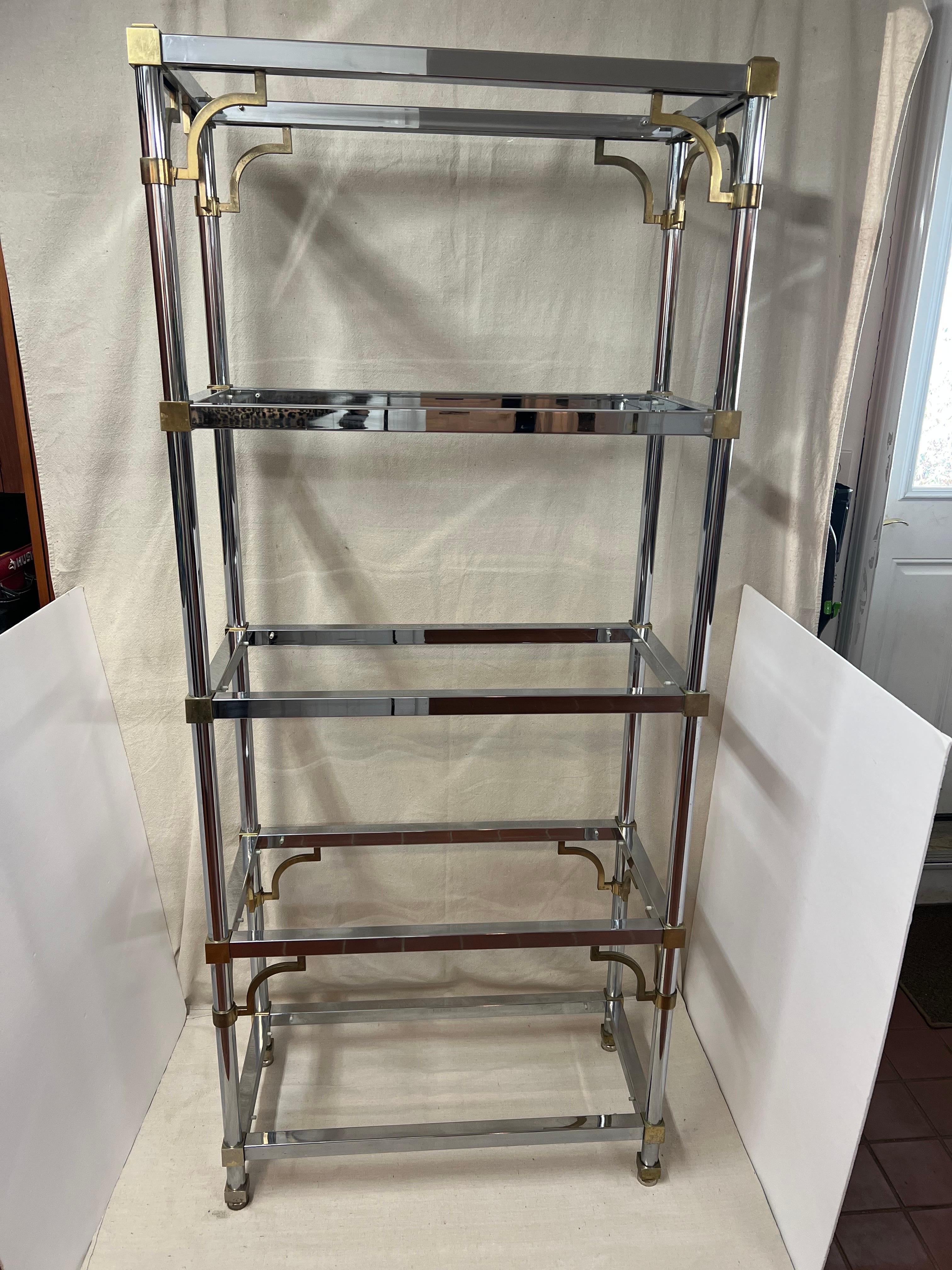 Maison Jansen chrome and brass Greek Key Etagere. Classic Directoire design with Greek key accents in brass to contrast with the chrome. Consisting of 5 shelves total including the top one. Great piece for books, decorative accessories or to show