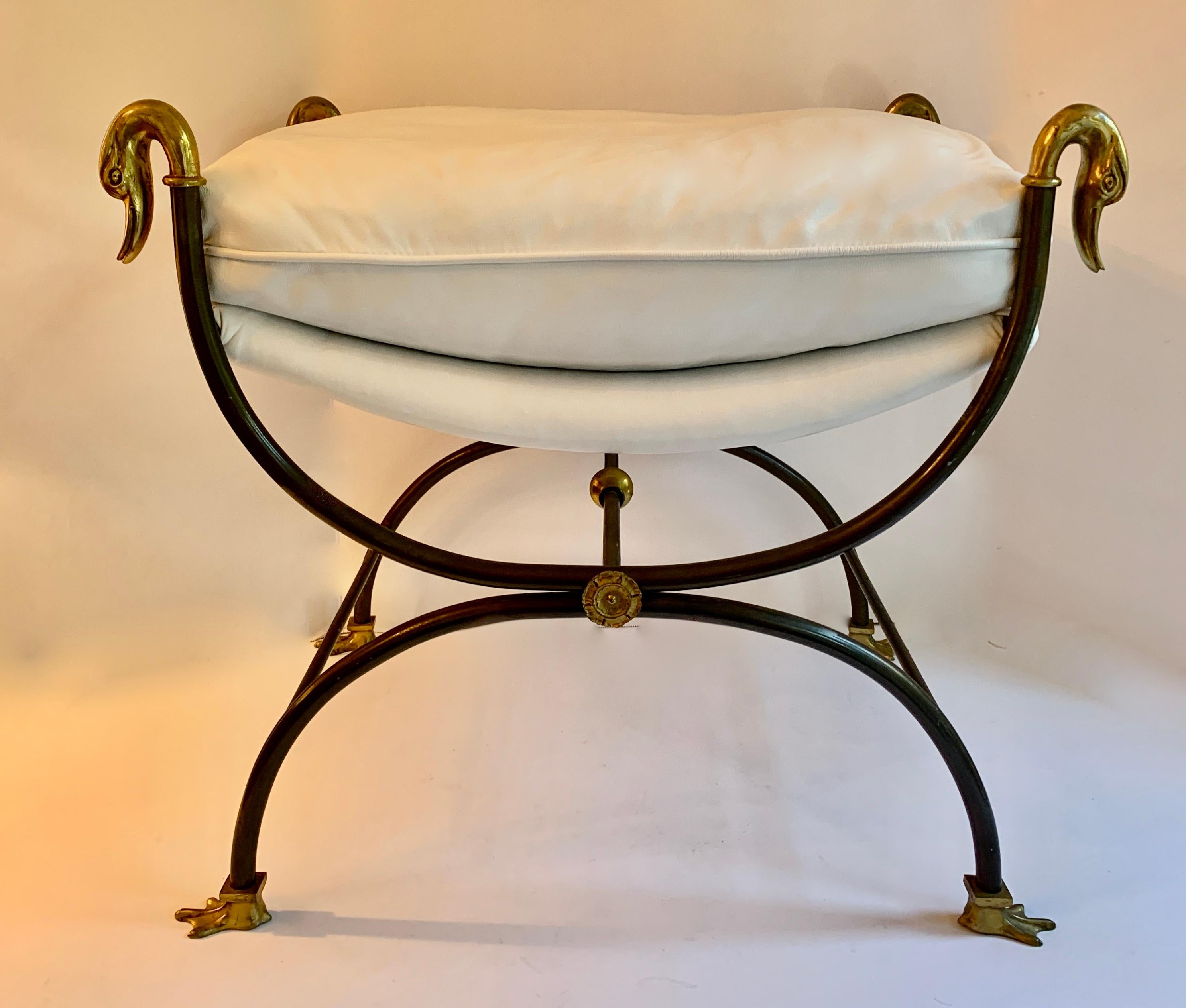 Maison Jansen metal vanity stool upholstered in Mongolian lamb. This wonderful piece is in iron, with geese, feet and medallion details in brass. A compliment too many rooms, the vanity or dressing room.