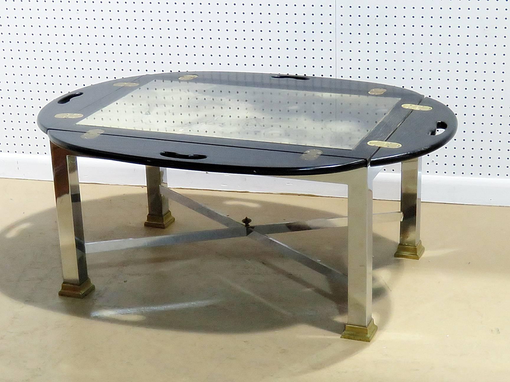 Maison Jansen butler's table with ebonized wood, chromed steel and brass accents. Measurements with leaves up: 22