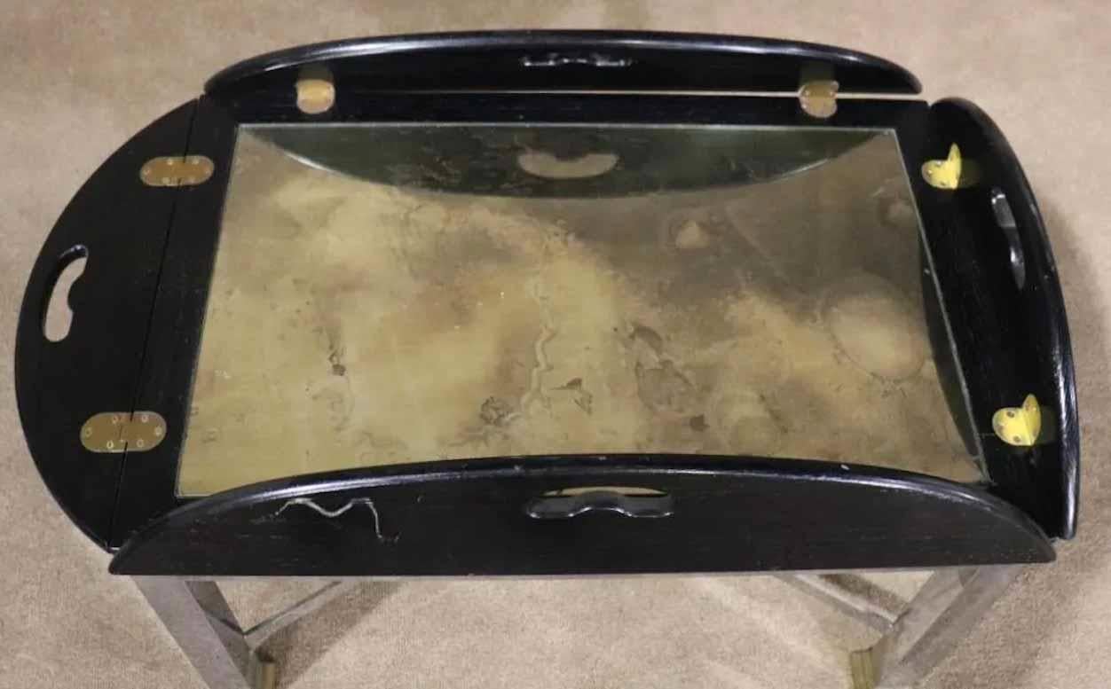 Coffee table with ebonized wood top on a chrome base. Aged mirrored top with leaves on all four sides.
Open: 41w, 30.75d, 17h
Closed: 32w, 22d, 22h

Please confirm location.