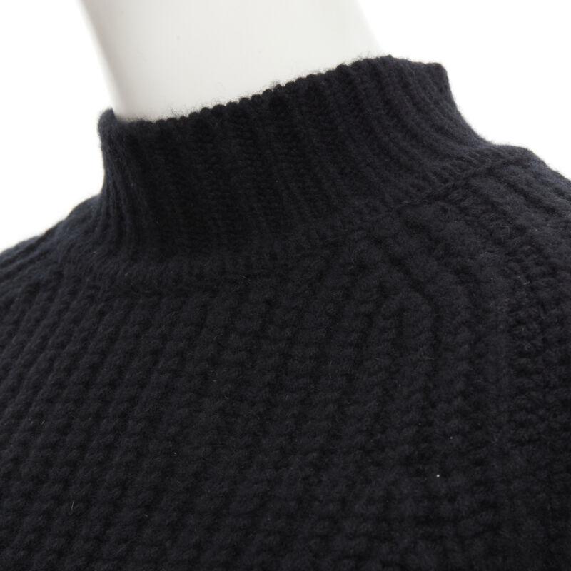 MAISON KITSUNE black 100% lambs wool chunky knit high neck sweater S
Reference: LNKO/A01864
Brand: Maison Kitsune
Material: Wool
Color: Black
Pattern: Solid
Extra Details: High neck. Raglan sleeve.
Made in: Morocco

CONDITION:
Condition: Excellent,
