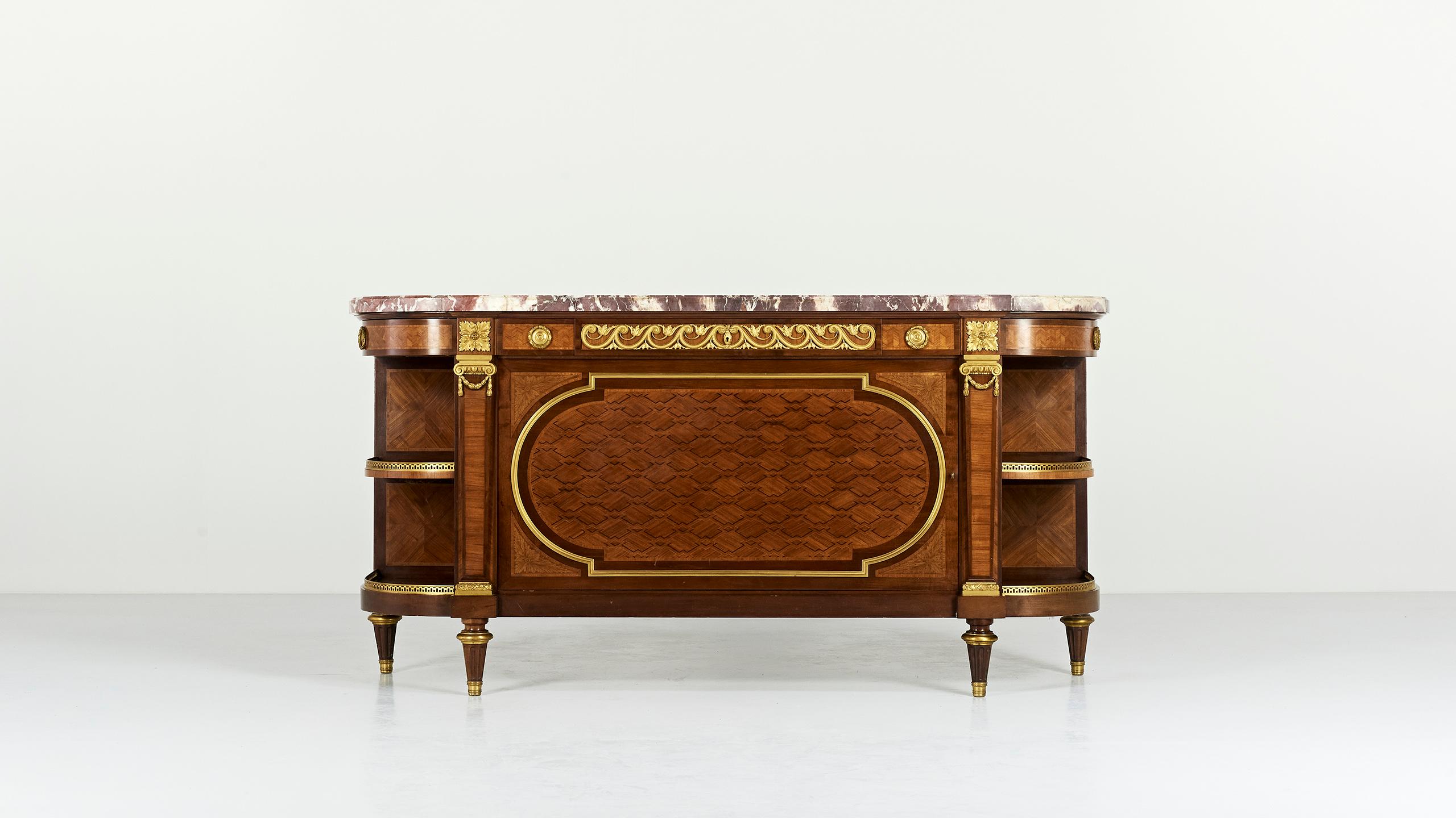 An exquisite and spectacular credenza, Louis XVI style furniture, produced around 1830 by Maison Krieger, after the work of prominent cabinetmaker Jean Francois Leleu. It displays a full mahogany marqueterie body enhanced by particularly fine ormolu