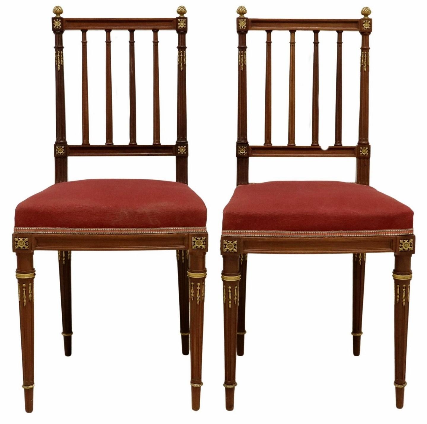 A pair of very fine quality antique French Louis XVI style gilt bronze ormolu mounted mahogany side chairs, attributed to luxury Parisian furniture maker Maison Krieger (1826-1910)

Exquisitely hand-crafted in Paris, France, in the late 19th