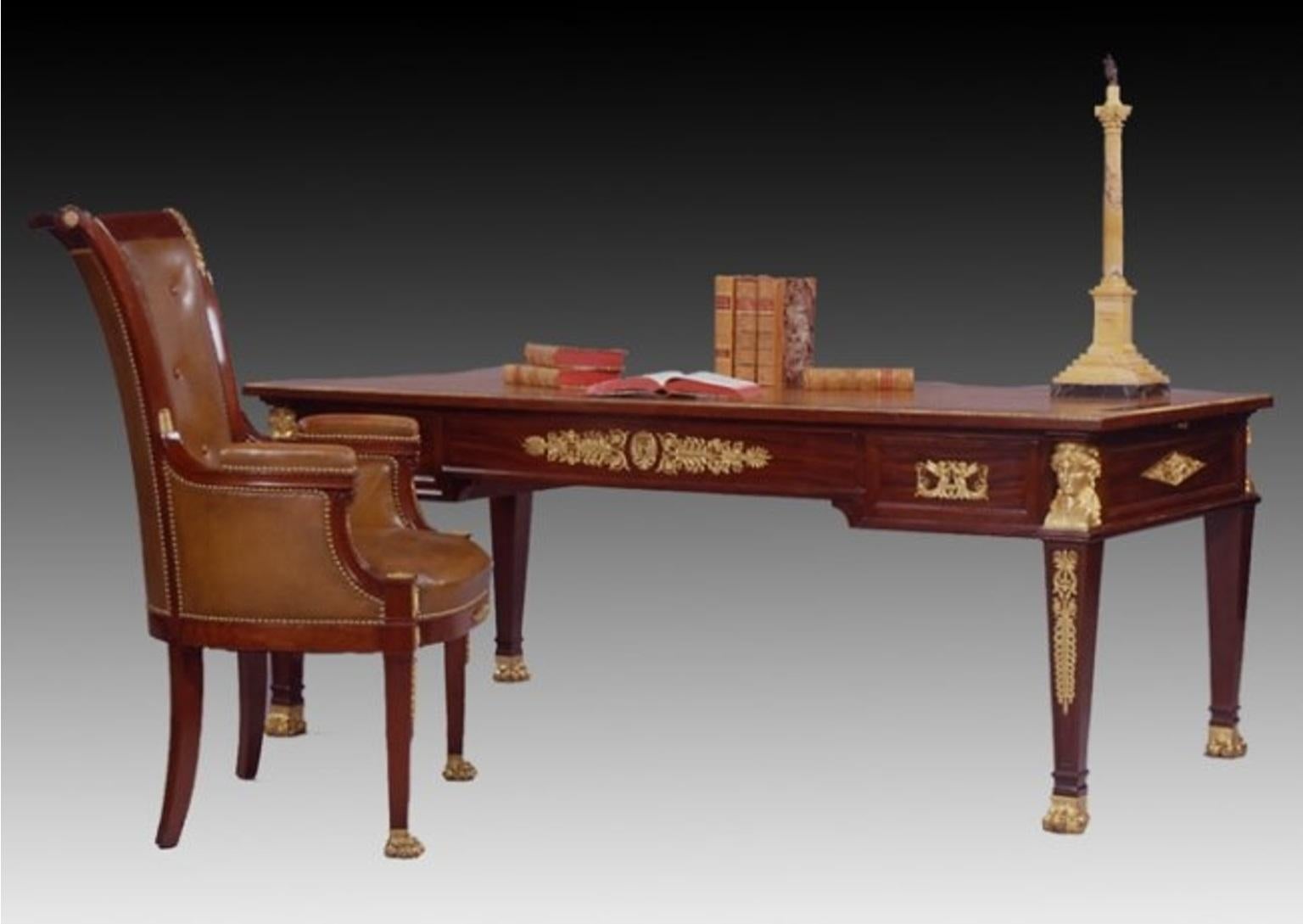 Fine suite of Empire style ormolu-mounted mahogany library furniture,
Maison Lalande, Paris, 1890-1900, 
comprising: a bureau plat, a large cartioneire and three tub chairs, each with applied gilt bronze crowned female headed terms, anthemion,