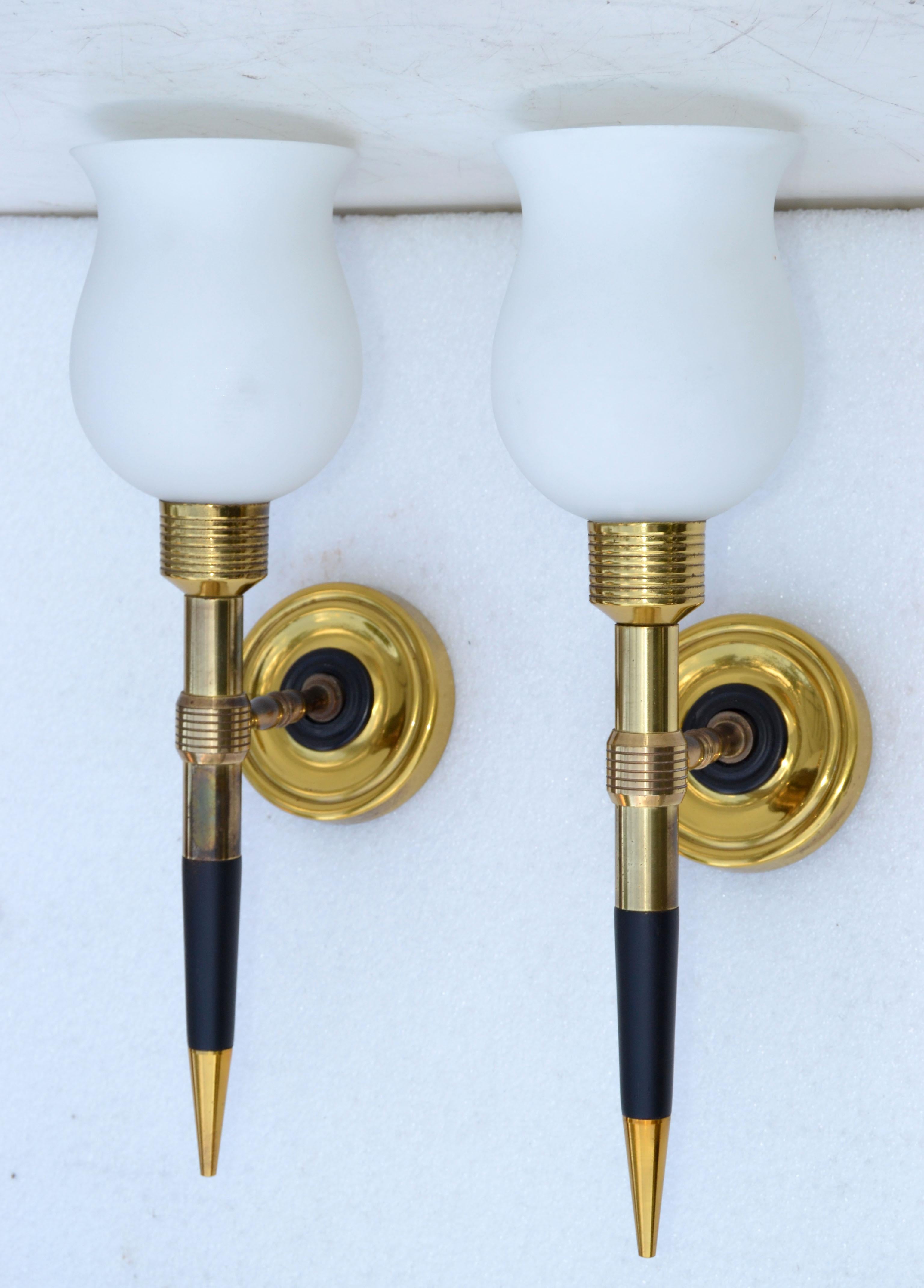Superb pair of Maison Lancel sconces, wall lamps in Brass and black lacquered wood.
Each comes with the blown original Opaline Glass Shade, 2 sizes available.
US rewiring and each takes one light bulb with max 60 watts or LED.
Dimension without