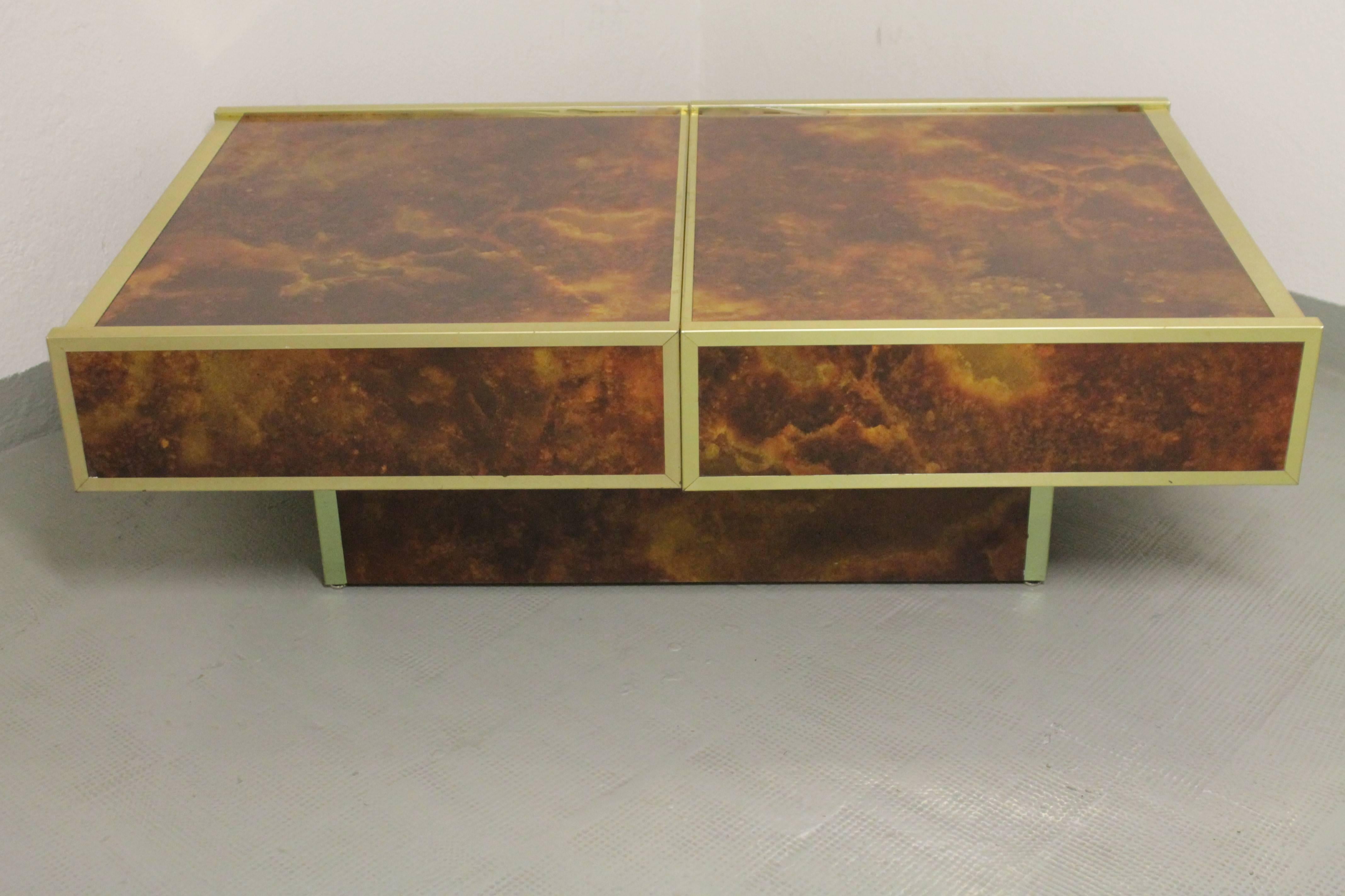 Brass and formica bar sliding coffee table in the style of Willy Rizzo
Produced by Maison Lancel, ca. 1970s
Good condition
 