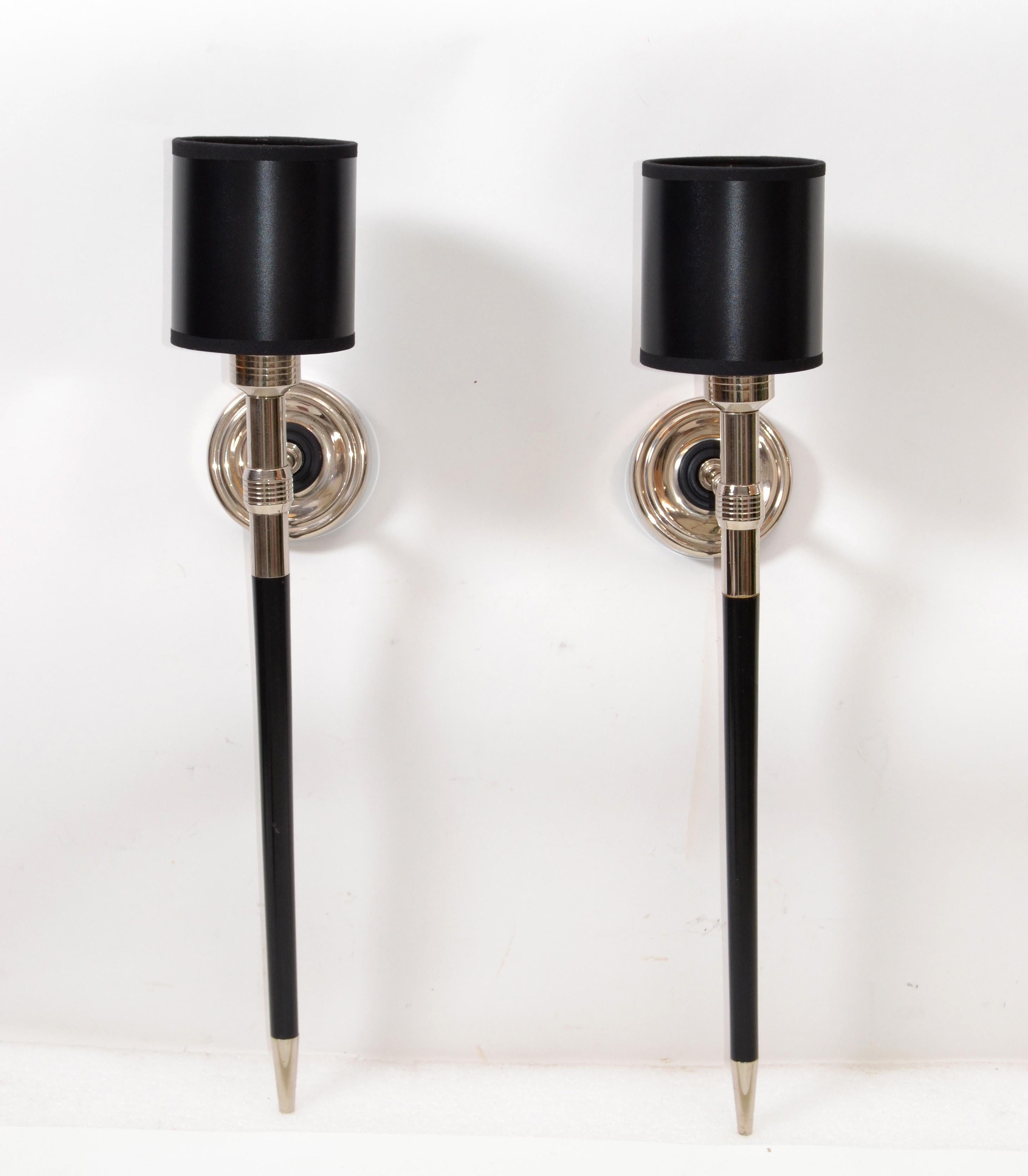 Very elegant pair of circa 1960 chrome and black wood sconces for Maison Lancel, France.
Wired for US and in working condition. Each wall sconce takes 1-light bulb with max. 40 watts.
Back plate: 3.75 inches diameter
Shades are included if