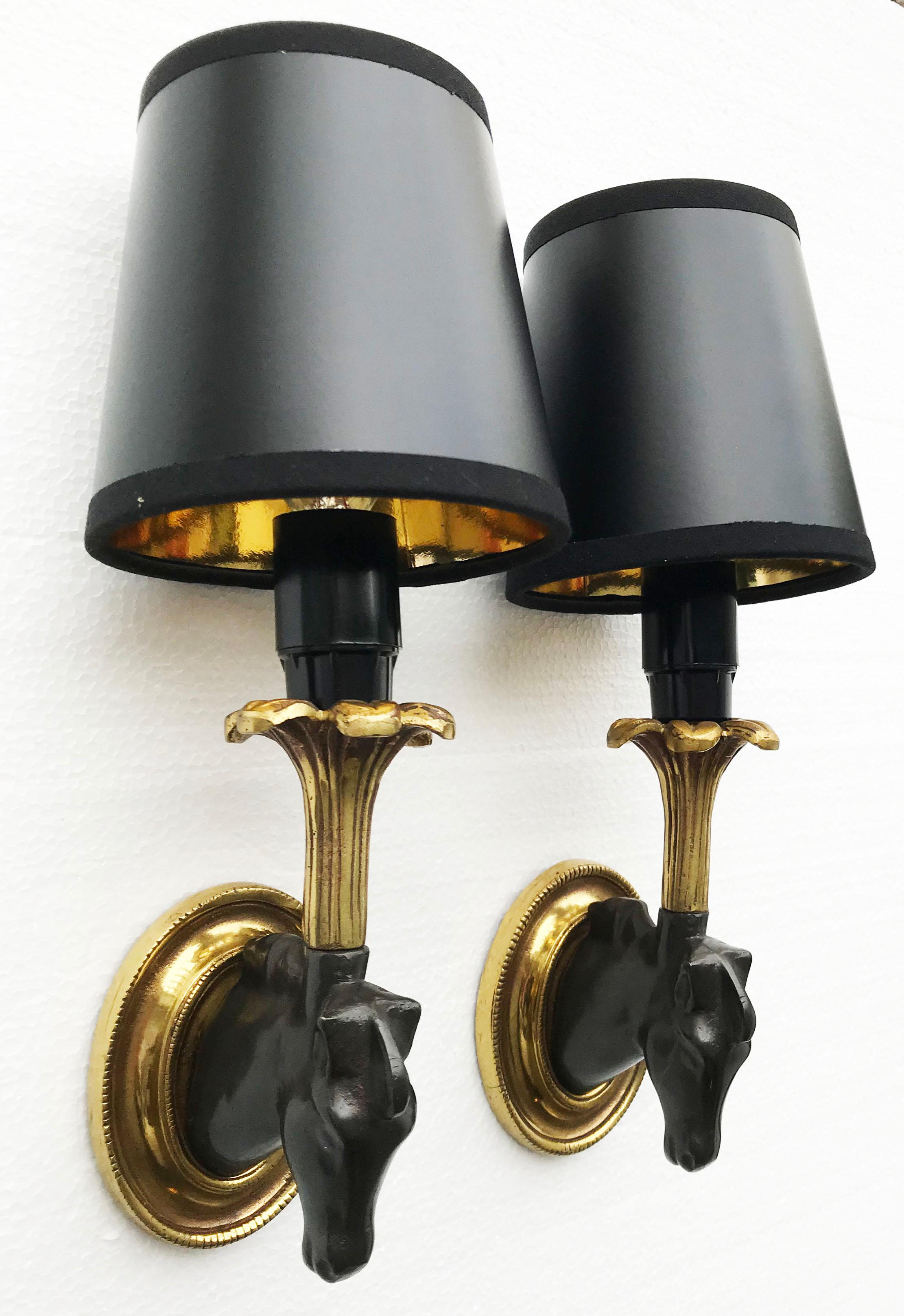 Superb pair of 2 patinas Horse sconces, bronze and brass color, by Maison Lancel, France 1960.
Measures: Shade 4 inches height, 4 inches base, 3 inches top.
Sconces without shade 7 inches.
Have a look on our impressive collection of French and