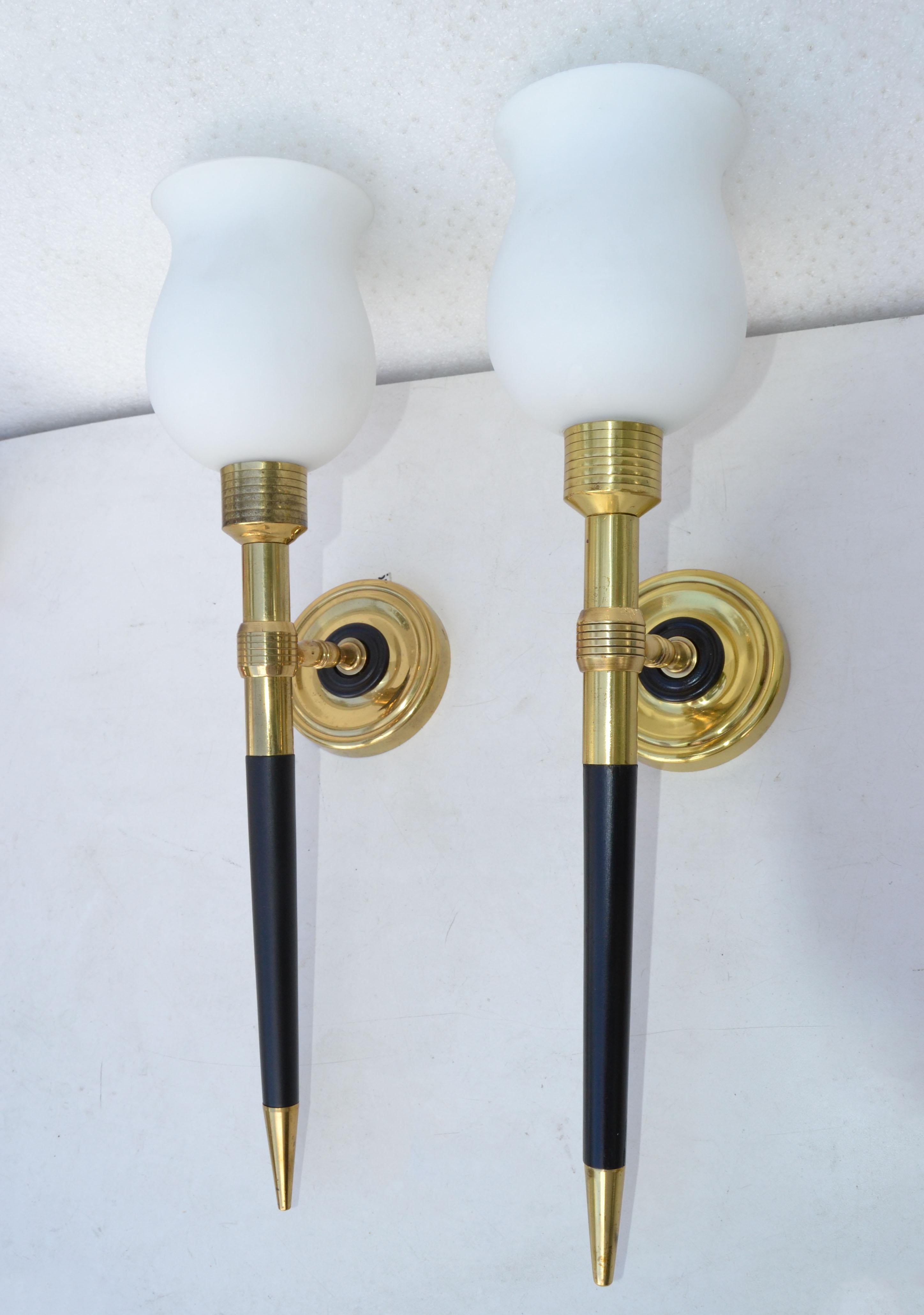 Superb pair of Maison Lancel sconces, wall lamps in Brass and black lacquered wood.
Each comes with the blown original Opaline Glass Shade: Diameter: 4x 5 inches Height. 
US rewiring and each takes one light bulb with max 60 watts or