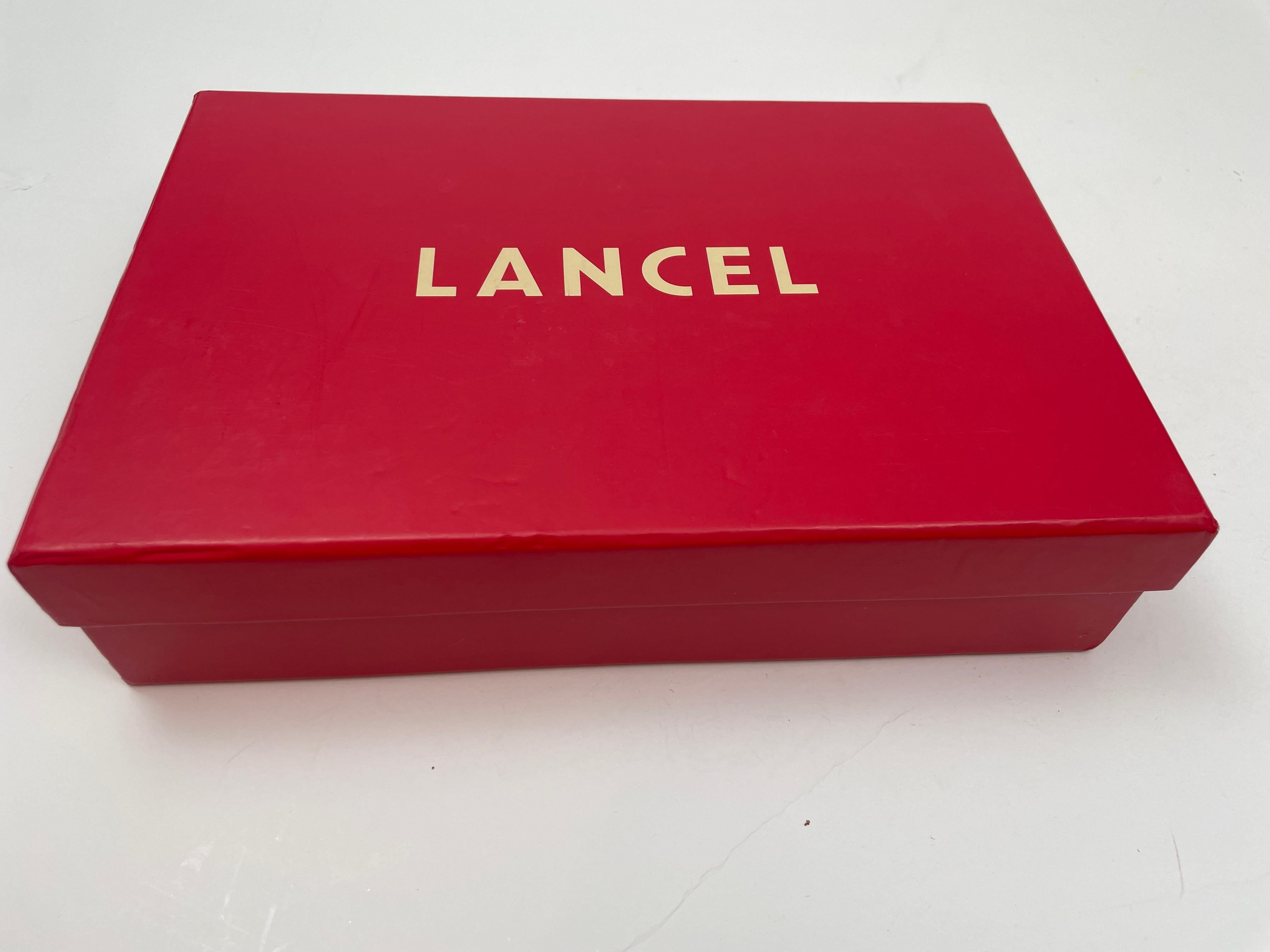 LANCEL with all-over logo print mini iPad case and stand.
For mini IPad,  case by Lancel France.
Blue and white canvas leather.
Lancel monogram logo throughout
Snap front and back closure
Flip front turns into a stand
Made in France.
Condition: