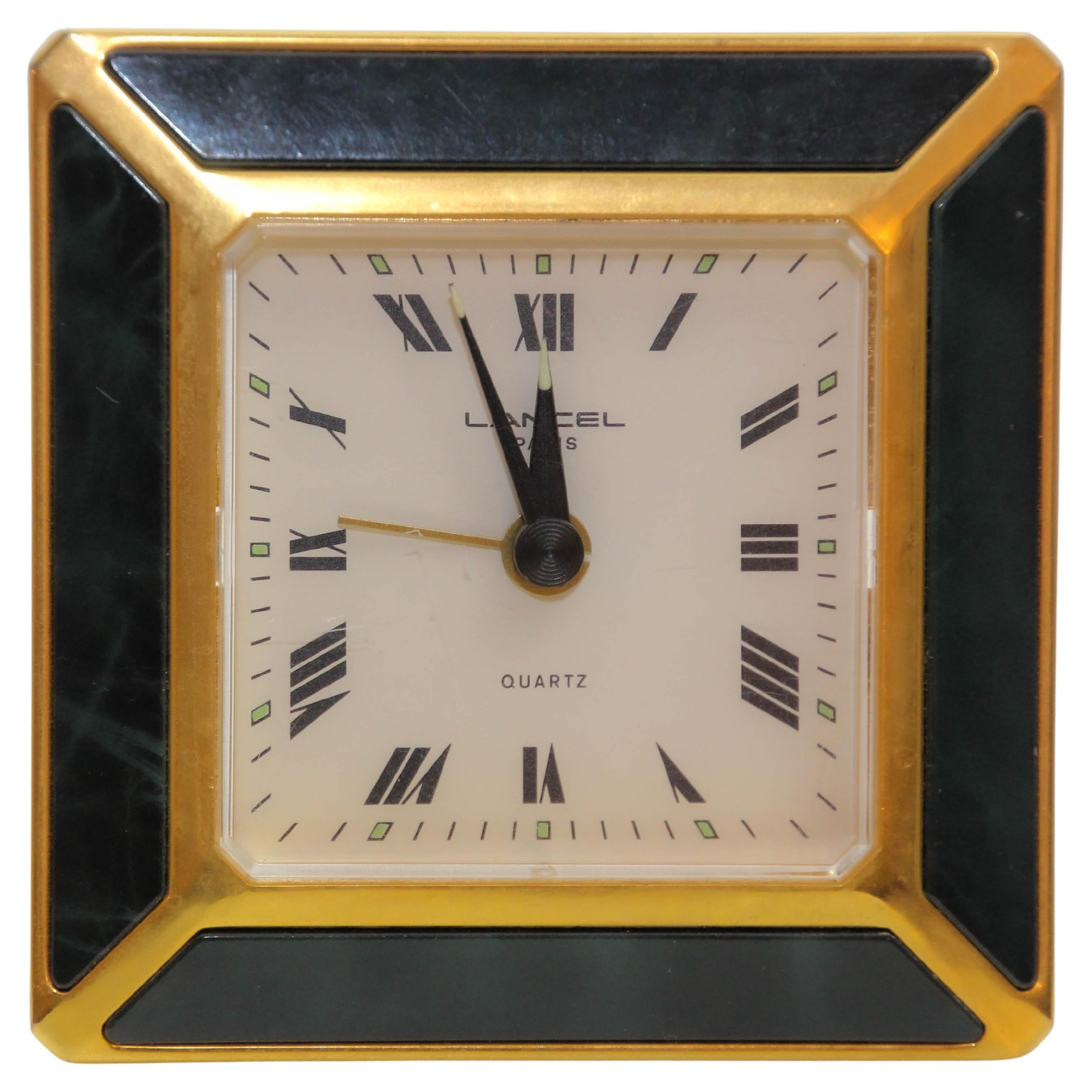 LANCEL Paris Classic Polished Brass Gold and Dark Irish Green Enamel Desk Clock or Travel Alarm Clock.
Maison LANCEL France travel clock in square shape.
Lancel Paris, quartz alarm clock, battery-powered, in a gold-colored metal brass frame and