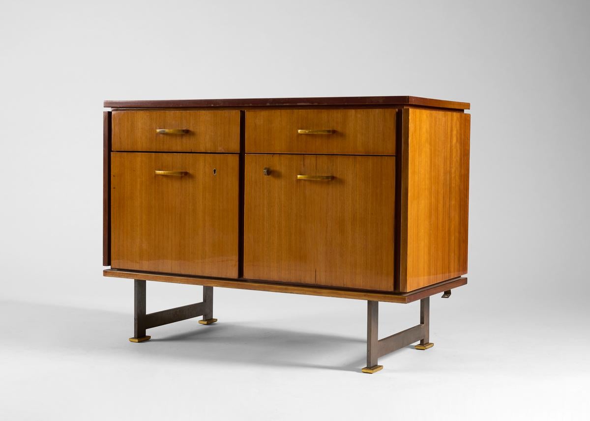 Walnut cabinet with sliding doors, removable shelves and metal legs by Maison Leleu.

Signed: Leleu Paris.

The house of Leleu rose to prominence in the 1920s during the Art Déco period, and became known for the ornate classicism of its richly