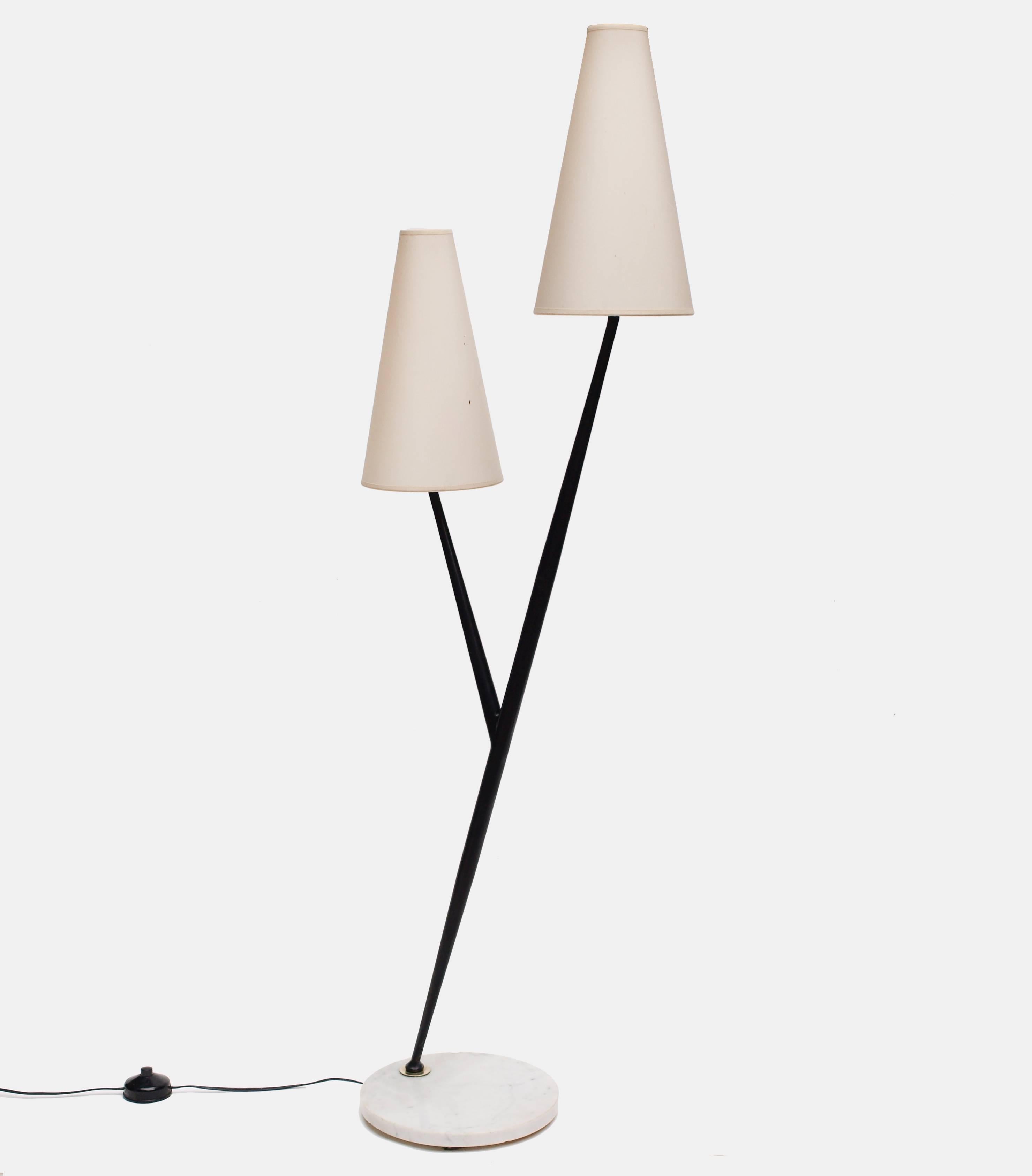 A rare and chic, 1960s floor lamp by Maison Lunel.
Rising from a white marble base a single tapered matte black branch splits at the mid-point to make a double headed lamp with its original silk shades.
Formed in the shaped of a Y this lamp has