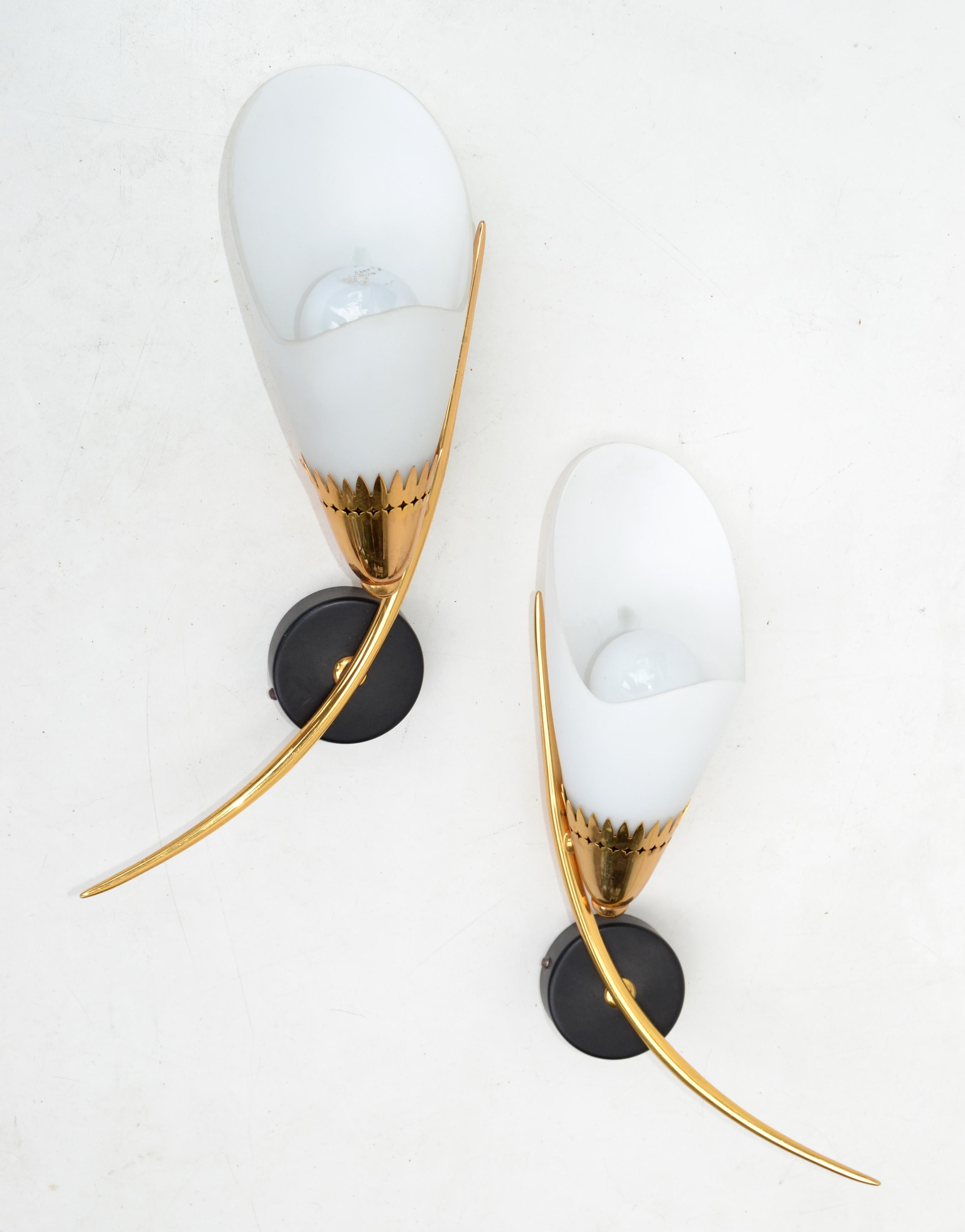 Pair of Maison Lunel sconce, wall light with original cone Opaline shades, made out of brass and steel.
Both are the same size and mirror image of each other, superb French Design from the 1960s.
Each Sconces takes 1 light bulbs with max. 40
