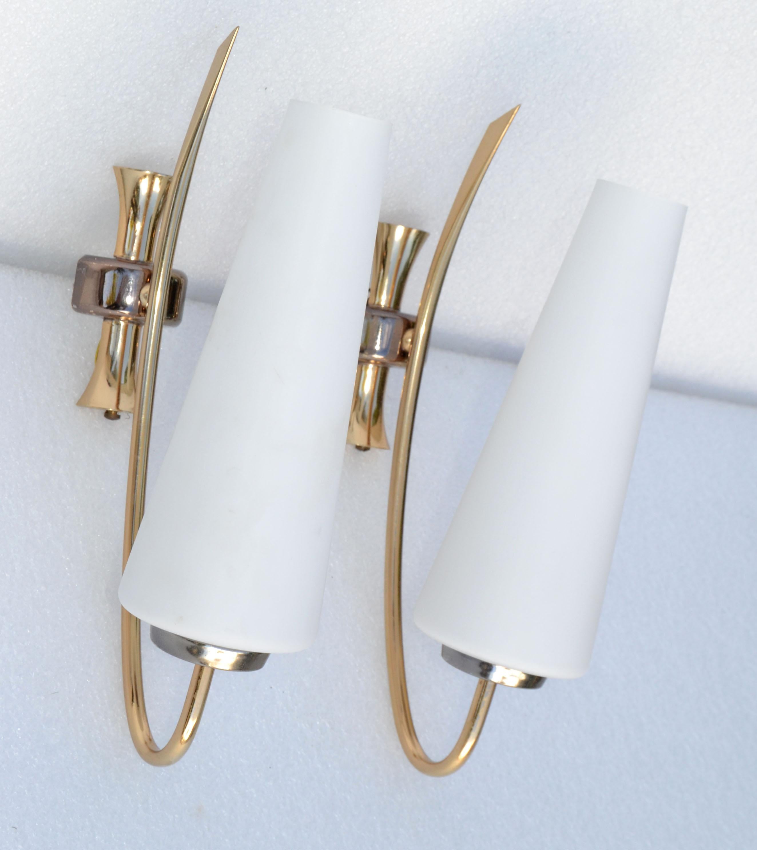 Pair of Maison Lunel sconce, wall light with original cone Opaline shades, made out of two patina Brass.
Superb French Design from the 1960s.
Each Sconces takes 1 light bulbs with max. 40 watts, LED work too.
Back Plate measures: 2 x 1