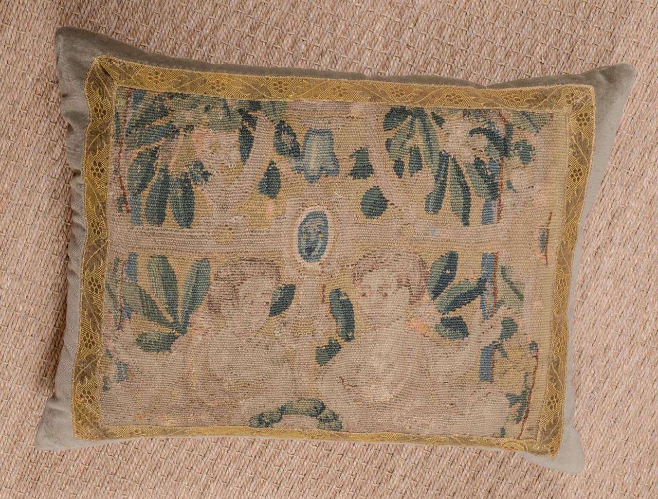 17th Century tapestry fragment pillow constructed with 100% cotton velvet. Tapestry is framed in Italian gold metallic trim. Down filled.